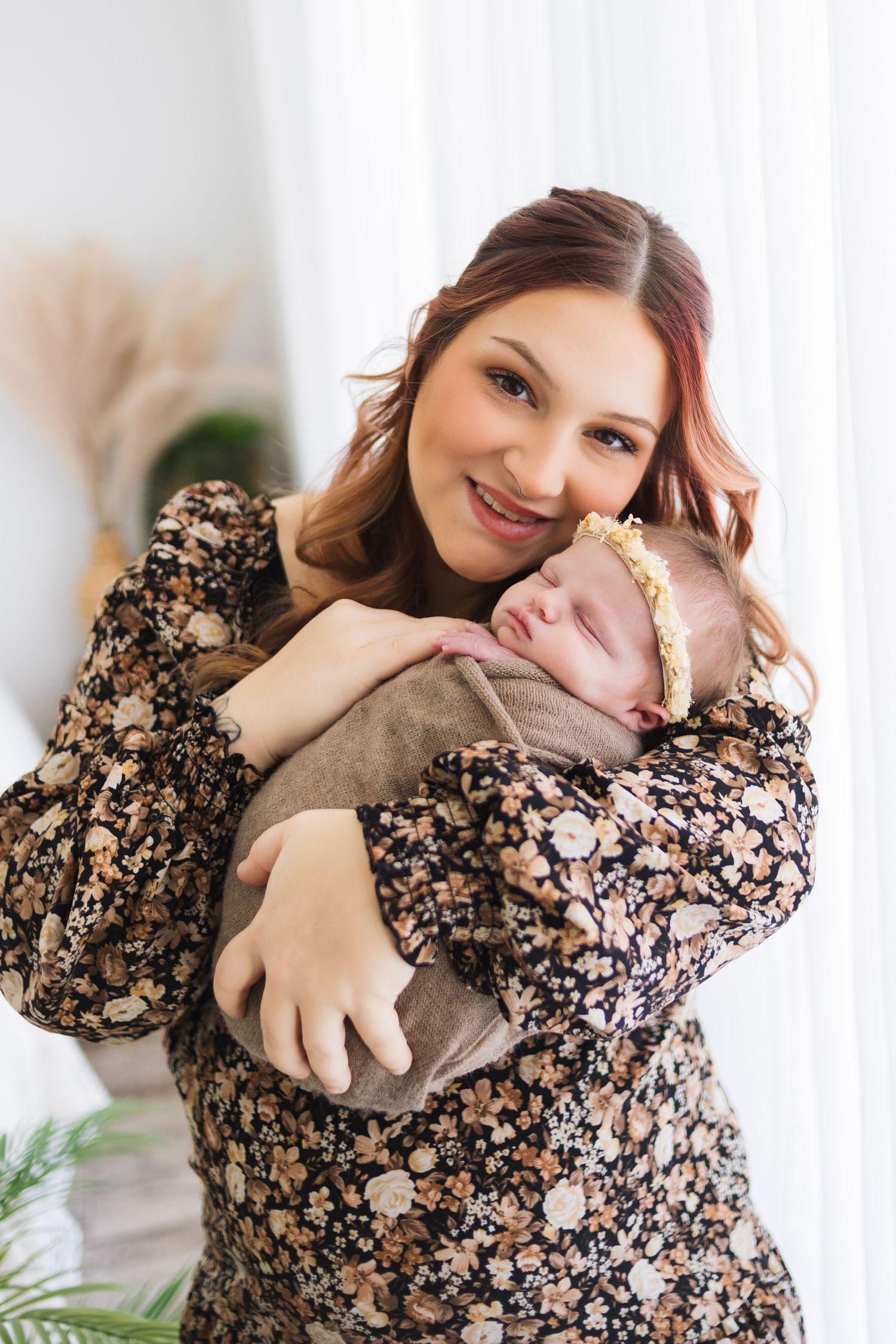 Springfield MO newborn photographer – mother holding baby during natural light lifestyle session by Fairchild Photo Co