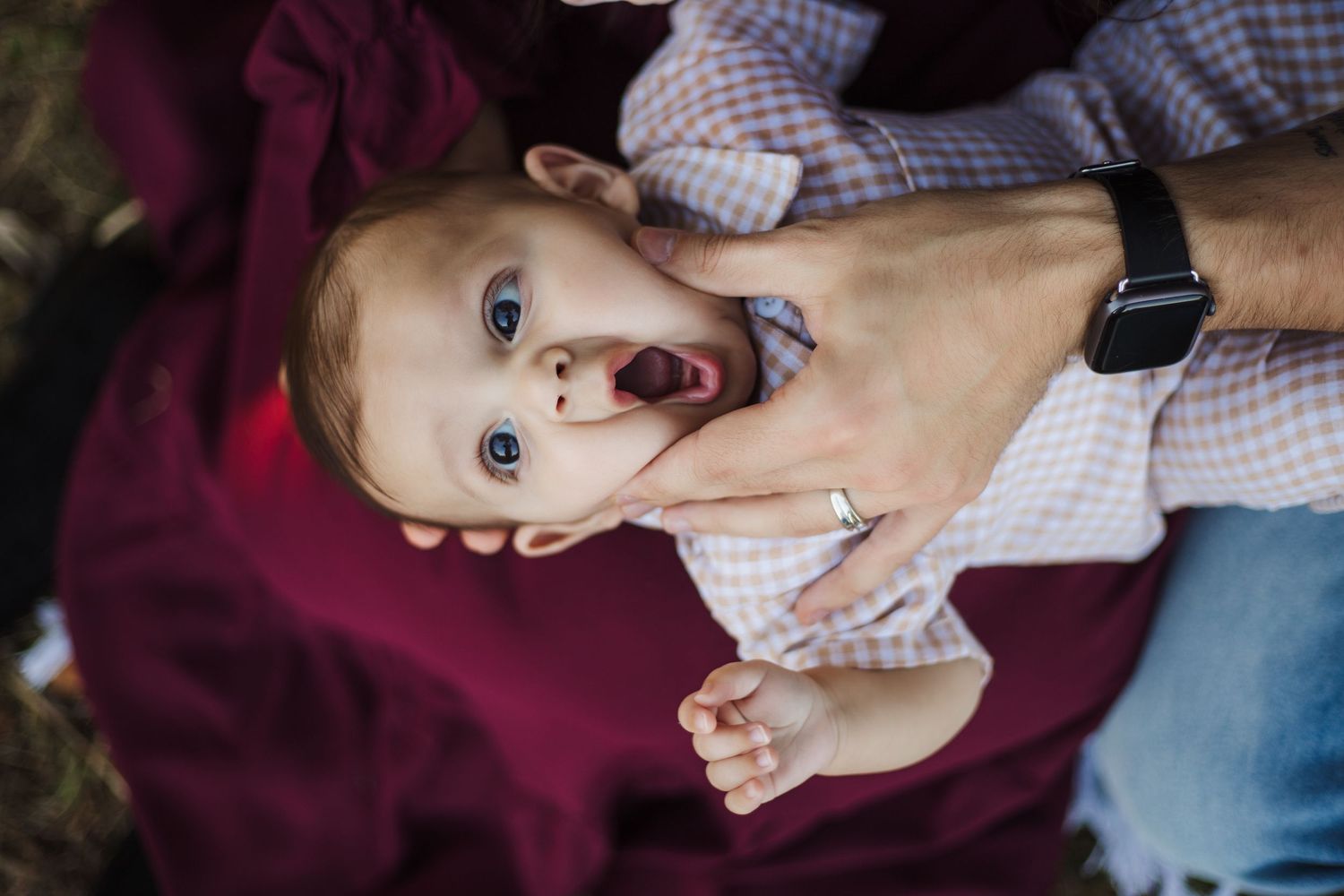 Close-up sequence showing hands applying a baby pacifier to an infant's mouth in a gentle manner.