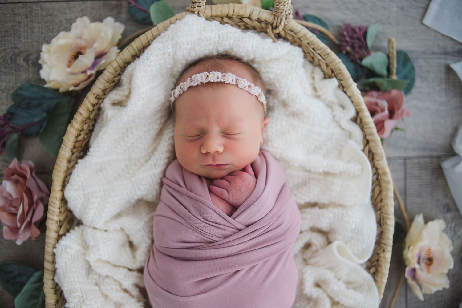 Neutral-toned newborn photography – swaddled baby portrait by Fairchild Photo Co in Springfield Missouri