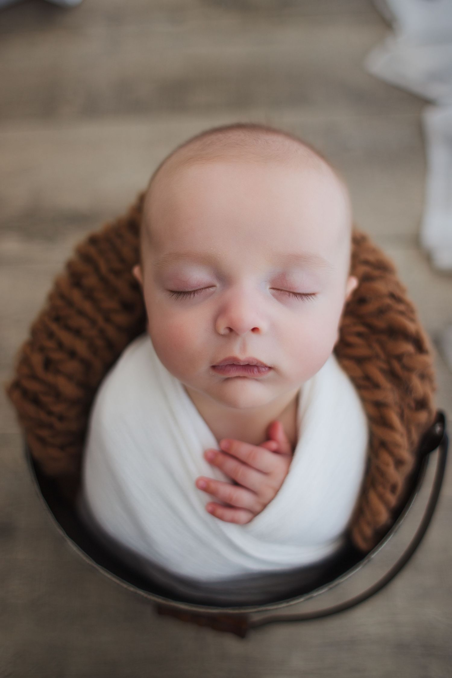 Baby in soft beige wrap photographed by Springfield MO newborn photographer Fairchild Photo Co