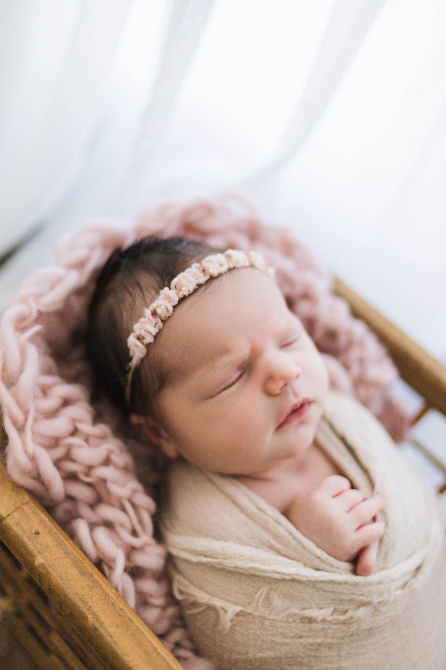 Springfield MO newborn photographer capturing baby in tan swaddle – timeless, simple styling