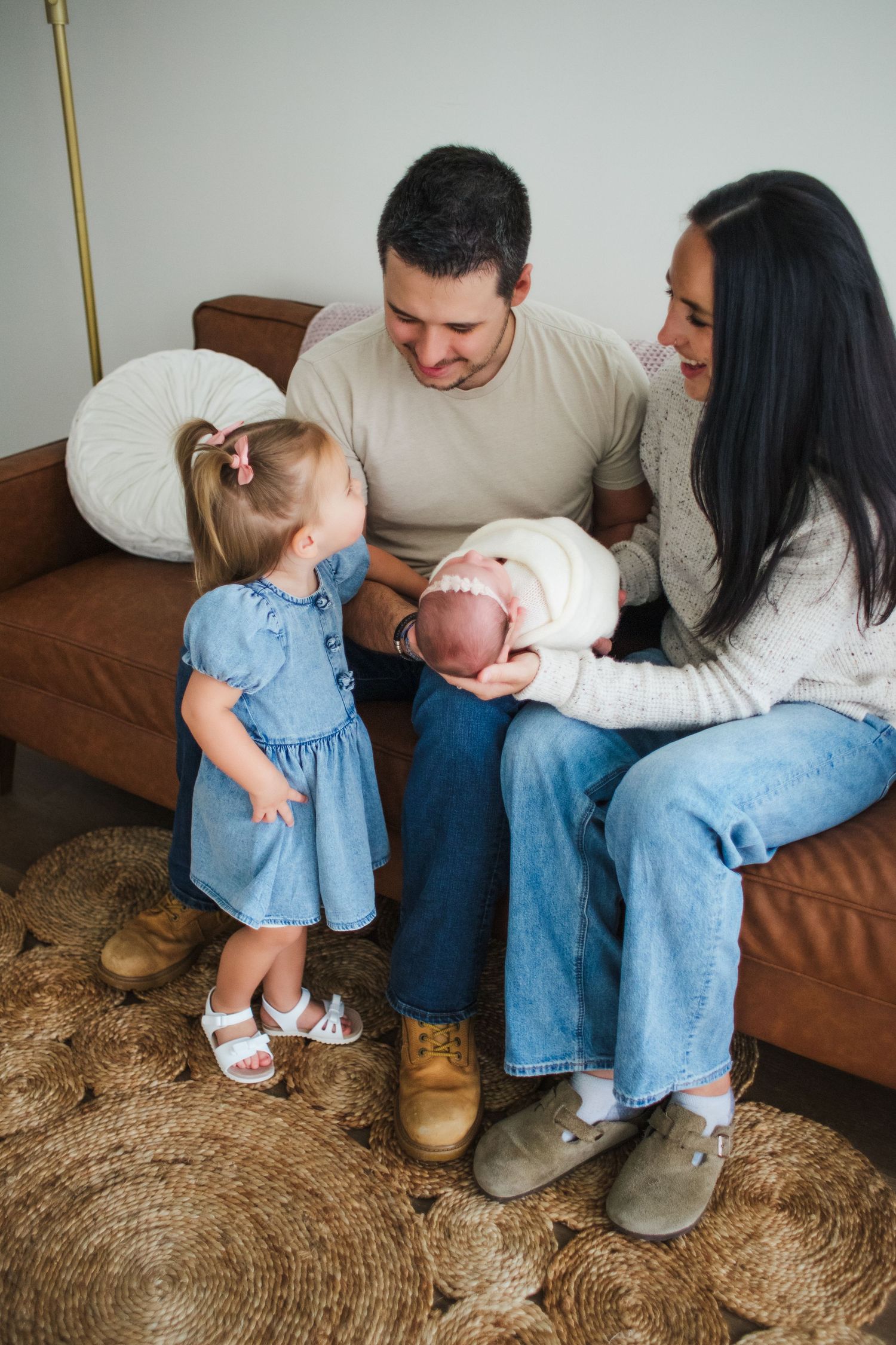 parents holding newborn baby natural light studio Springfield Missouri