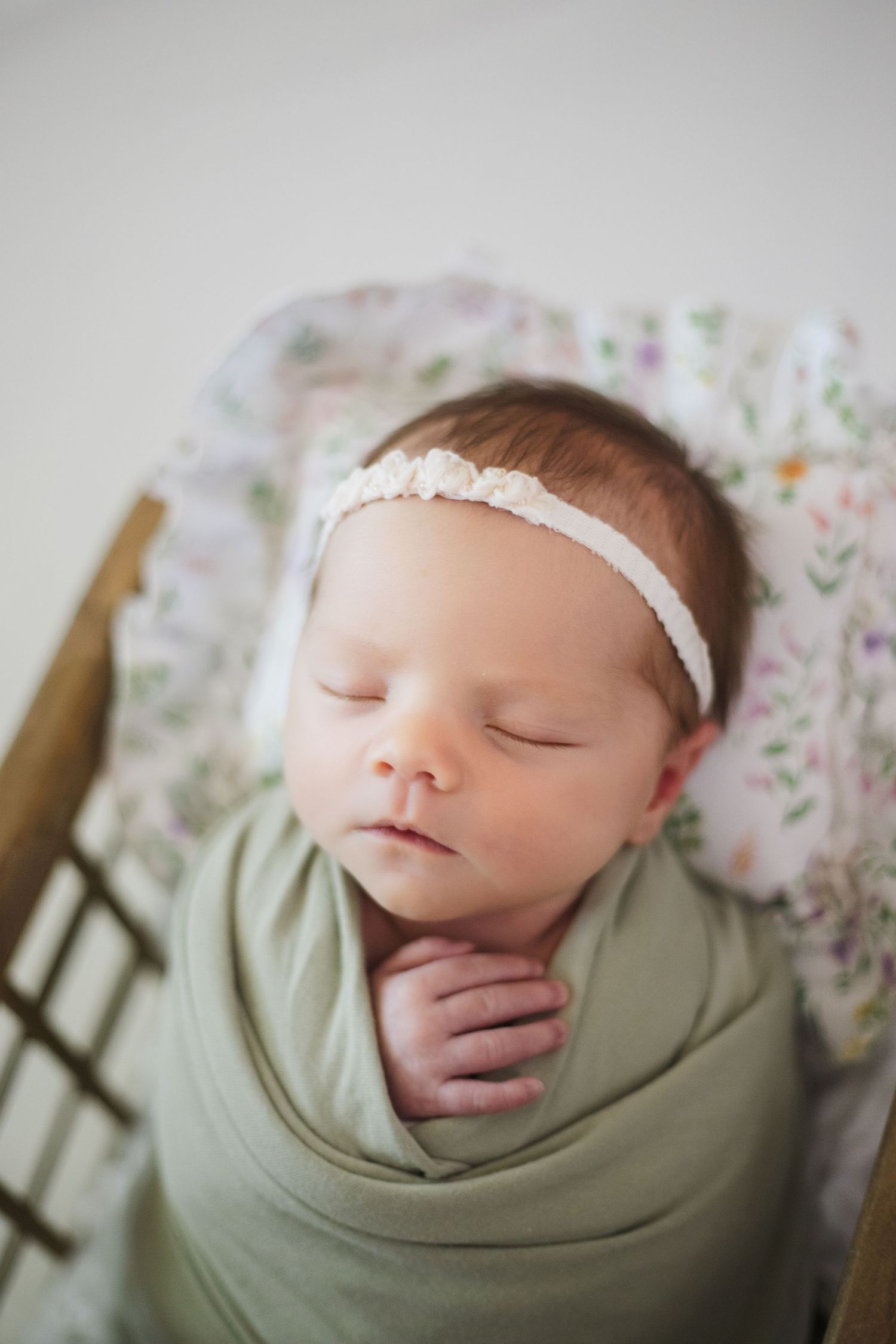 Peaceful newborn in neutral swaddle – professional Springfield MO newborn photography by Fairchild Photo Co