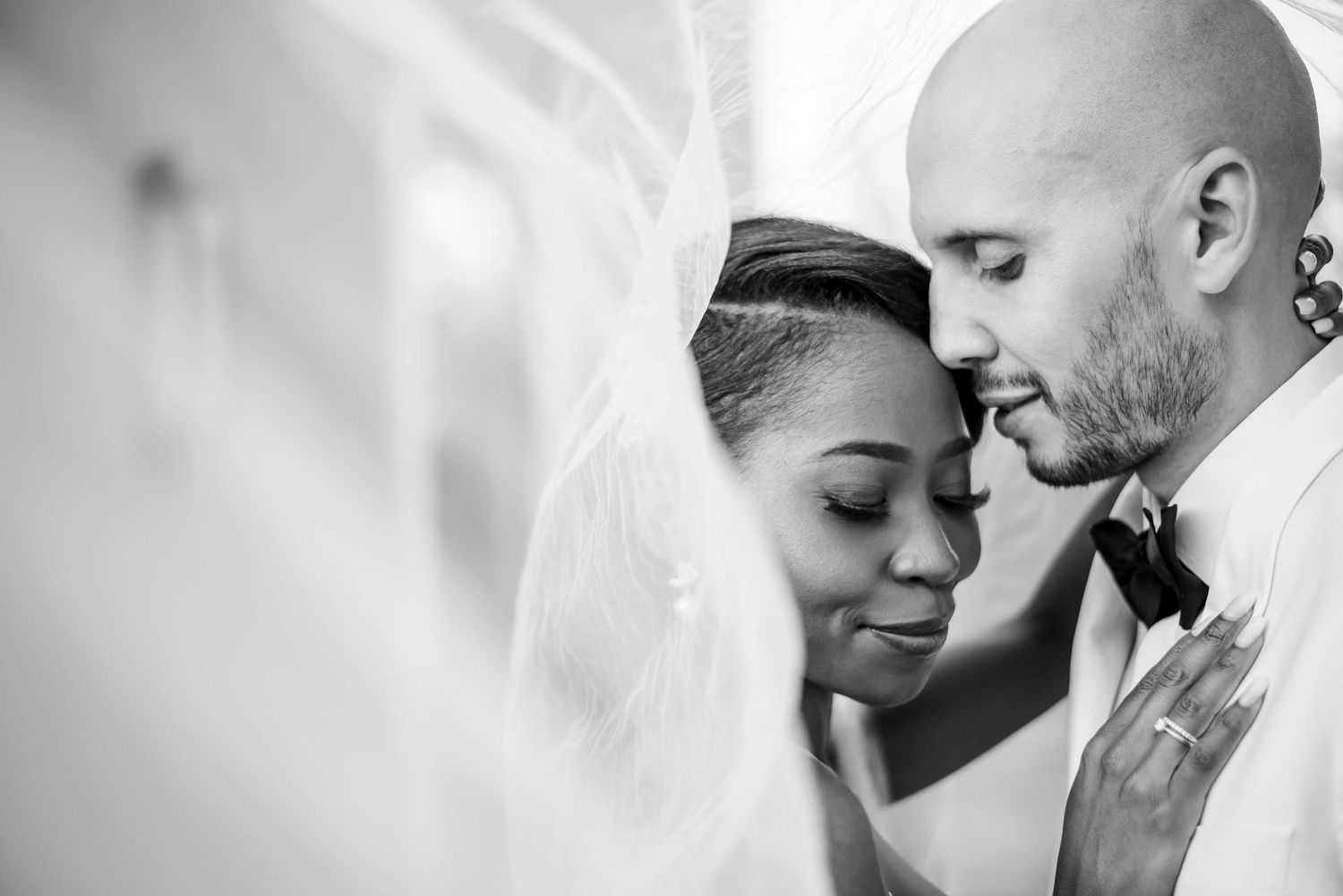 A black and white collage of intimate romantic moments showing couples embracing and sharing tender moments together.
