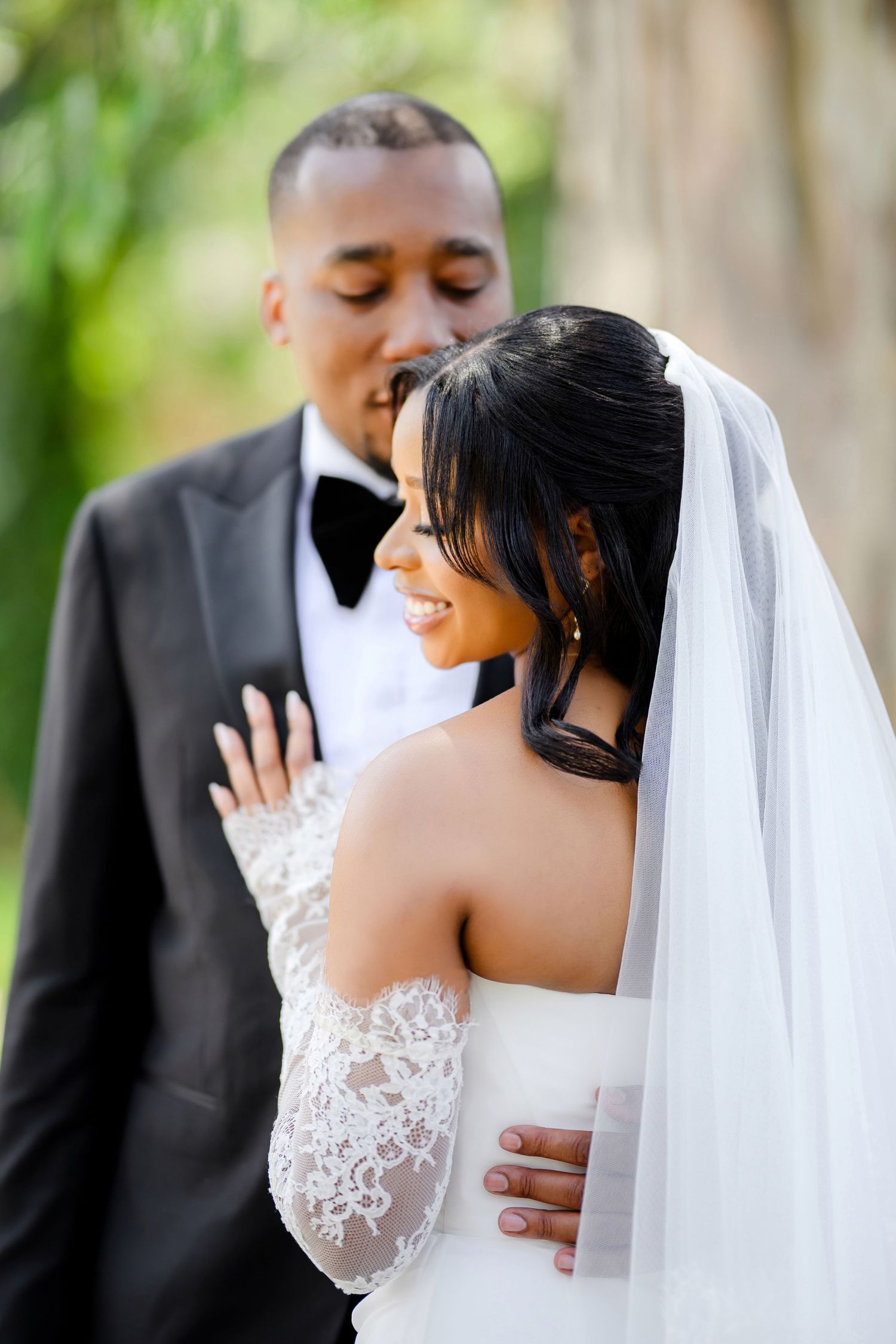 Romantic wedding sequence showing tender moments between newlyweds in traditional black tuxedo and white lace gown.