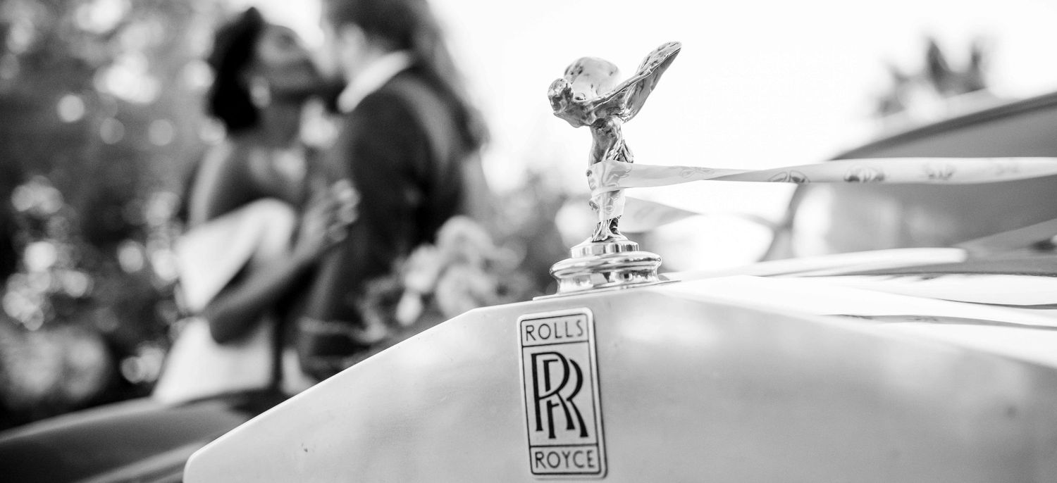 Close-up detail of a Rolls Royce Spirit of Ecstasy hood ornament in monochrome at Swakopmund