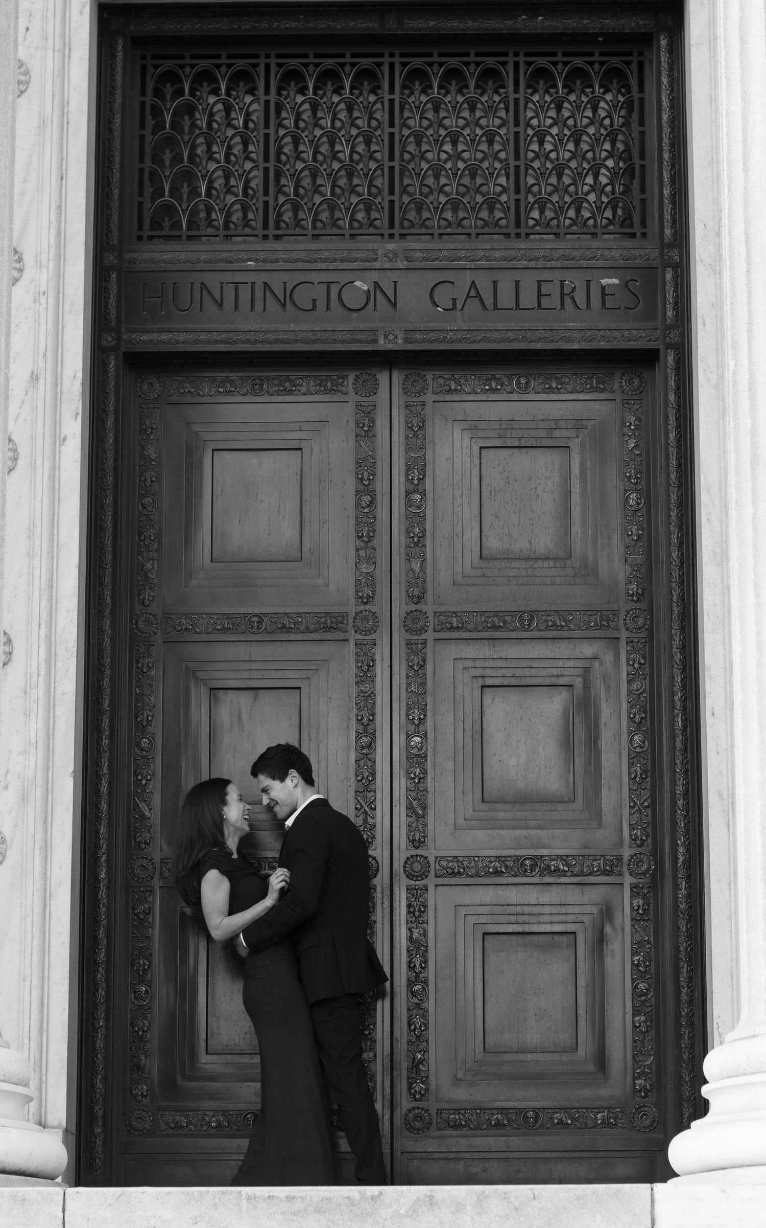 Engaged couple sharing a quiet moment outside the main doors of Cleveland Museum of Art in Cleveland, Ohio.