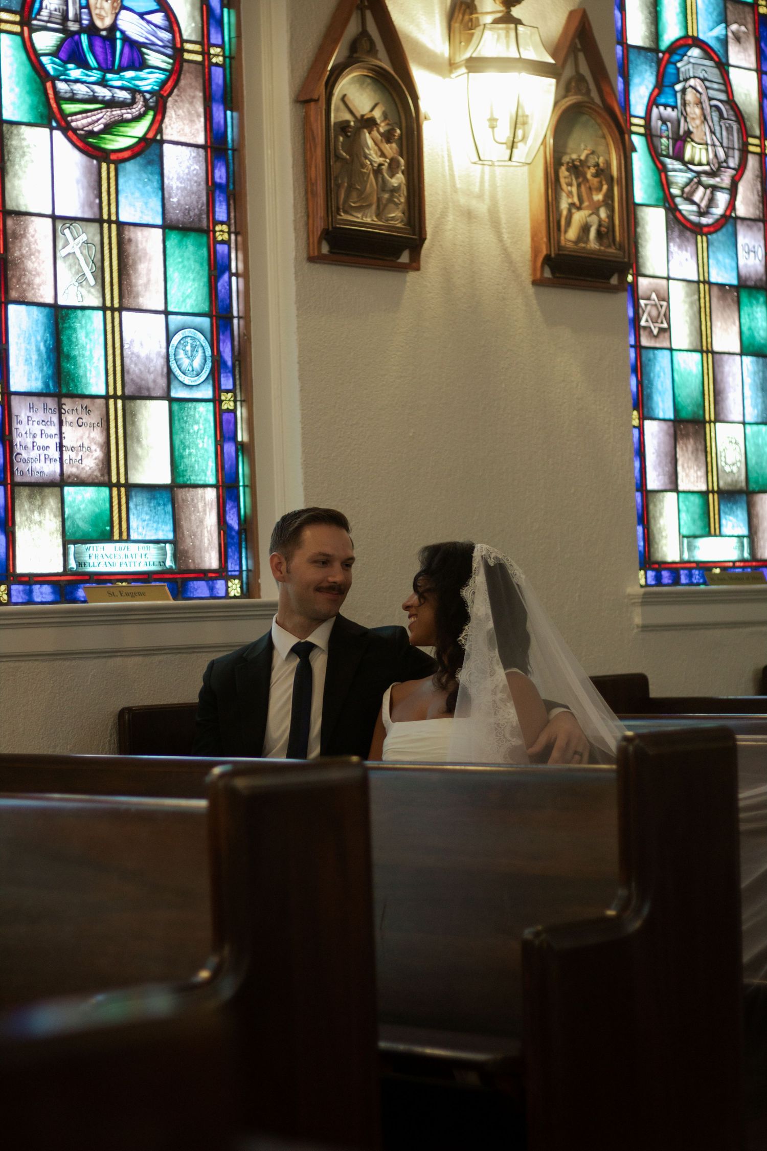 Bride and groom sharing a quiet moment inside their church during their Fayetteville wedding.