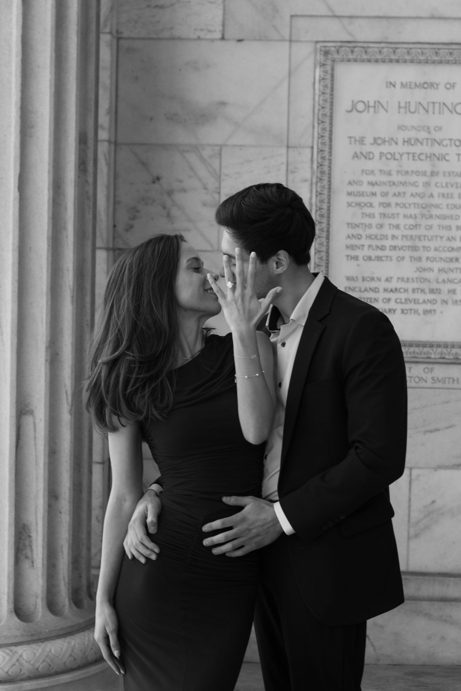 Engaged couple showing off ring outside the Cleveland Museum of Art in Cleveland, Ohio.