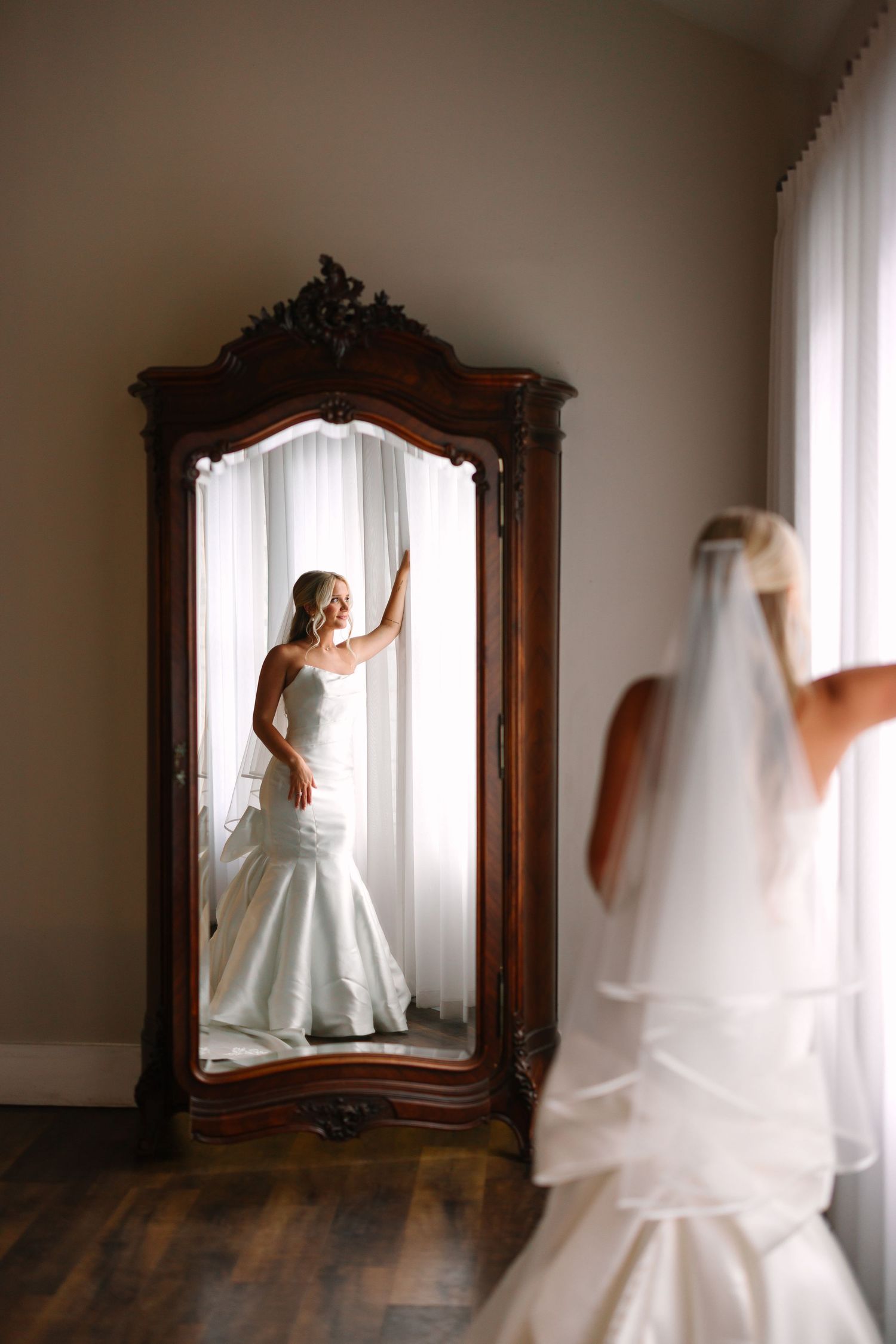 Artistic series of bridal portraits reflected in an antique wooden mirror.
