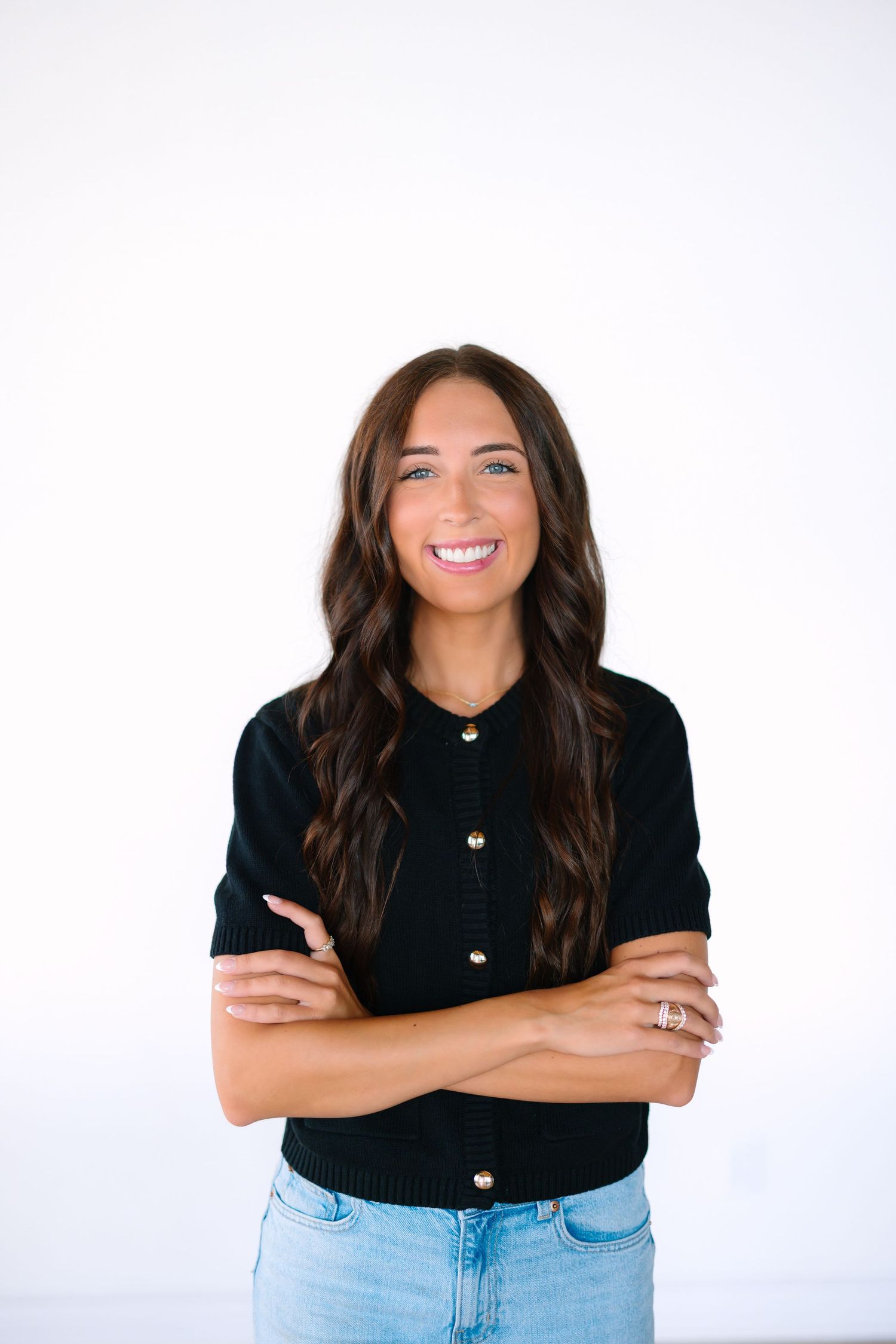 Portrait series showing casual poses in black top and light denim against white background.