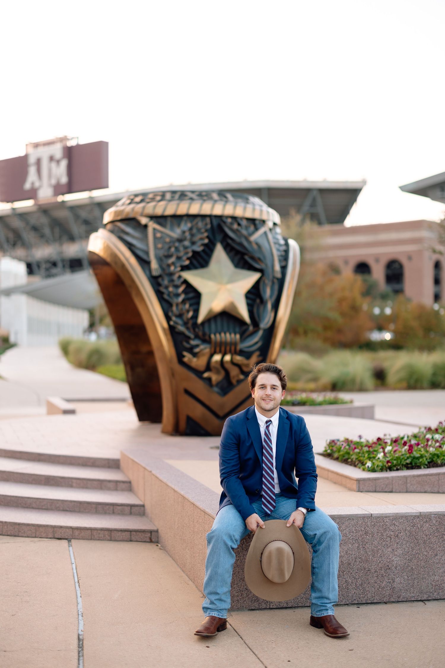 Architectural outdoor seating area with decorative star sculptures and stone steps.