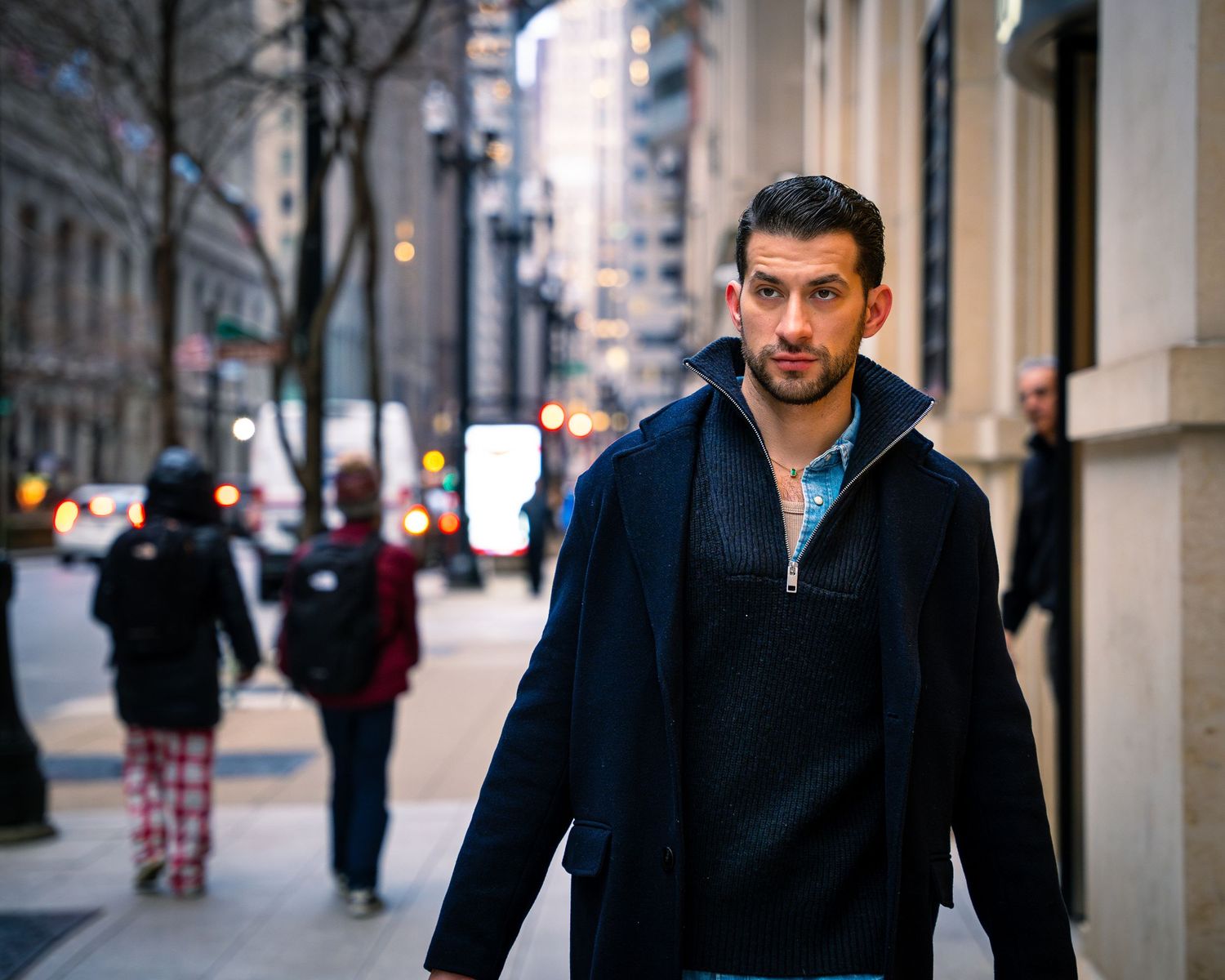 Street fashion photography showing winter casual wear in urban setting.