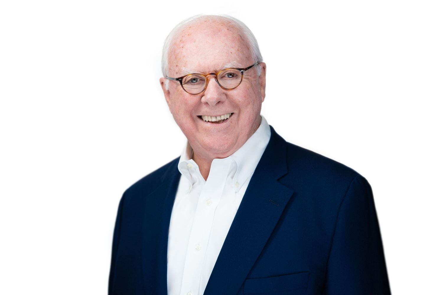 Professional portrait series featuring business attire against white backdrop.