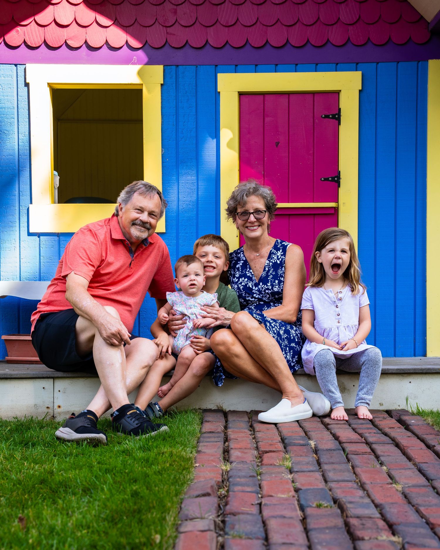 A series of candid photos showing a group sitting together on colorful beach hut steps.