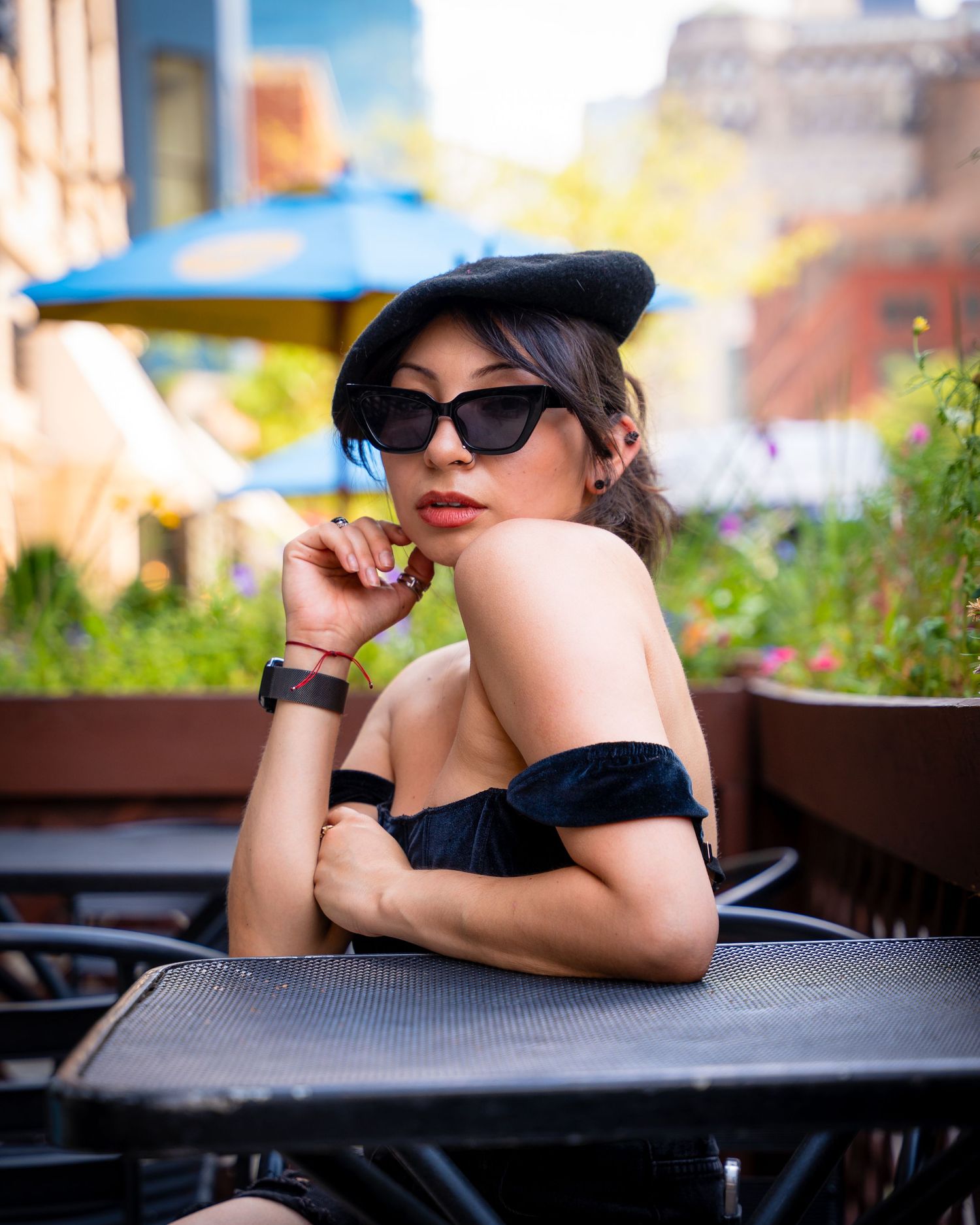 Glamour photography sequence featuring model in black with sunglasses on outdoor patio.