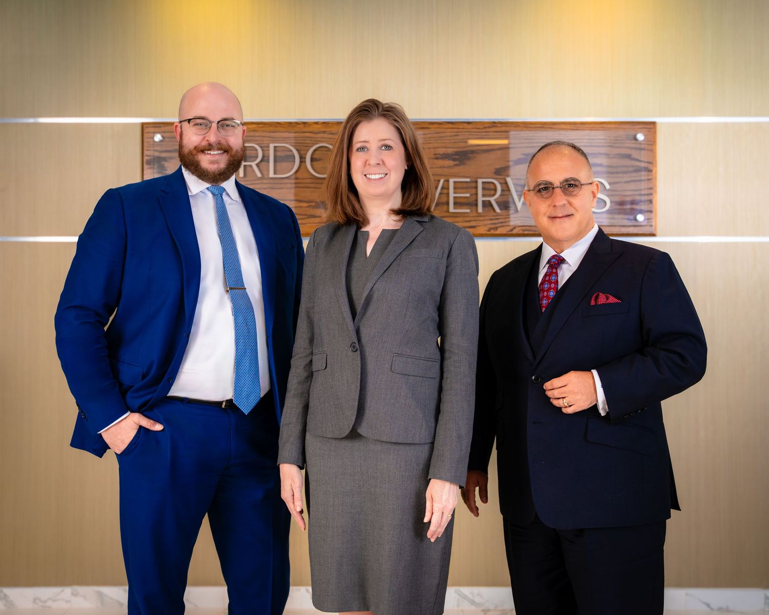 Professional attorneys meeting in modern office conference room.