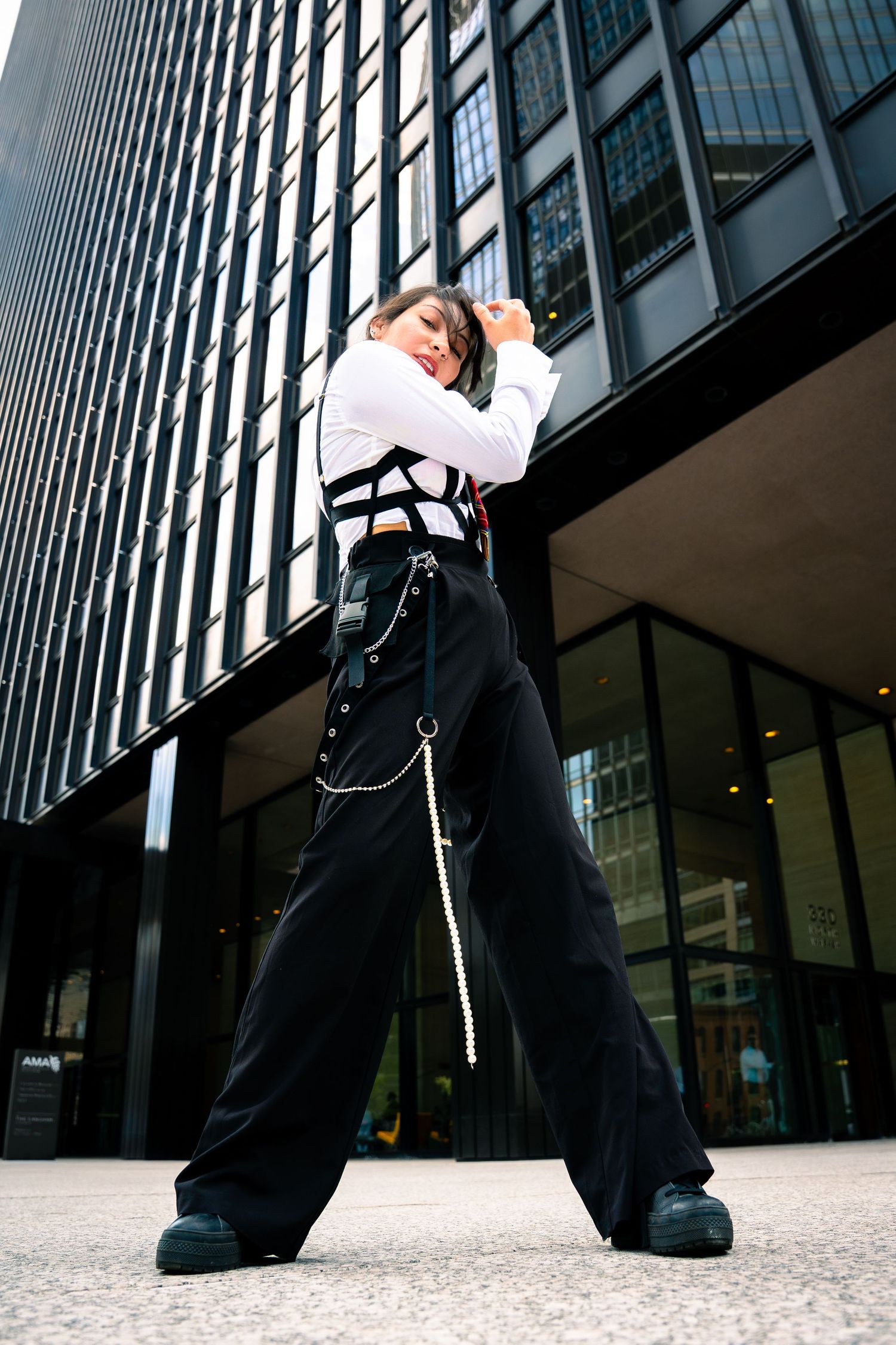 Dynamic low angle shot against modern glass building in urban setting.