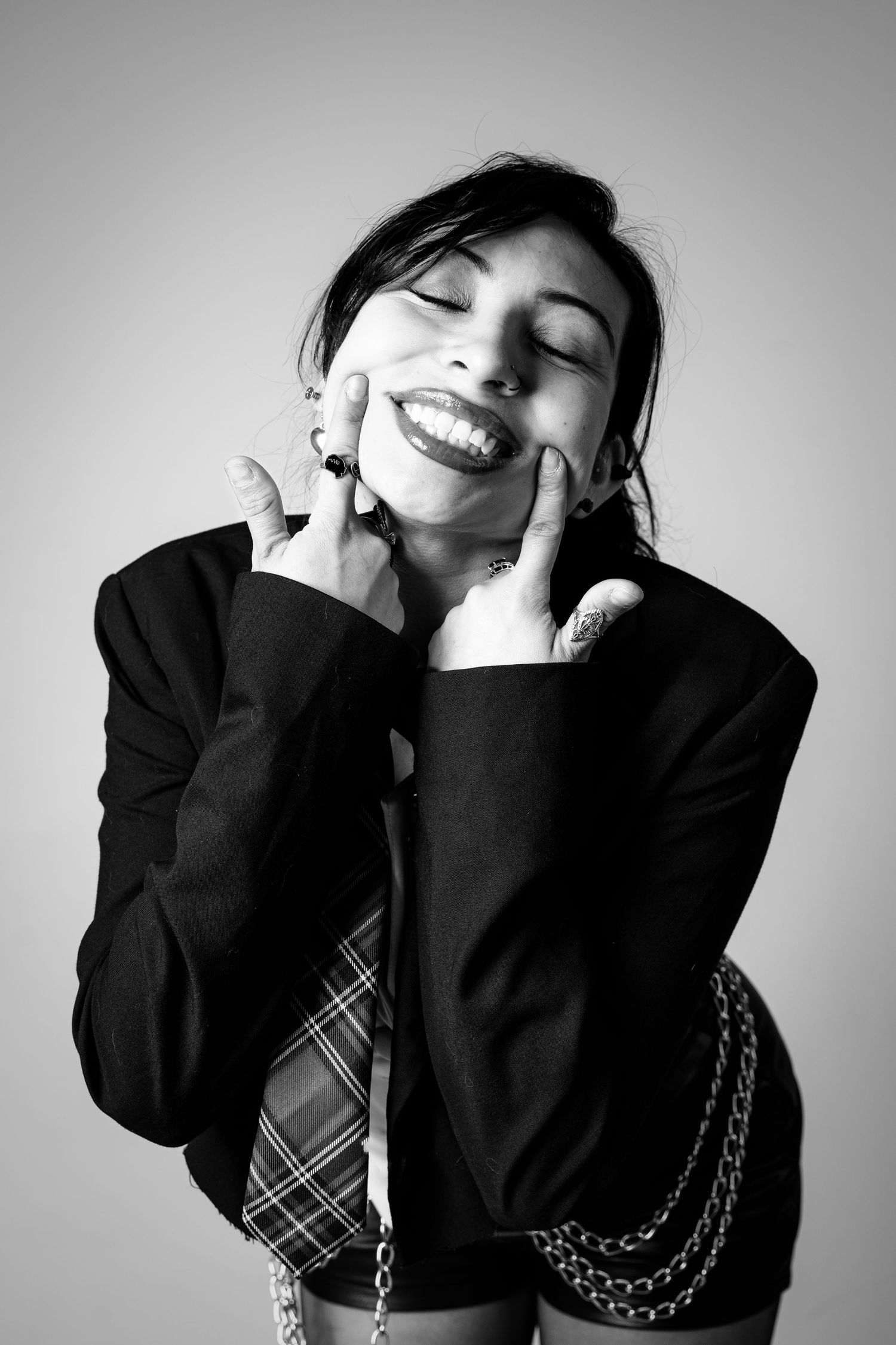 Expressive black and white portraits showing joyful emotions and dramatic gestures.