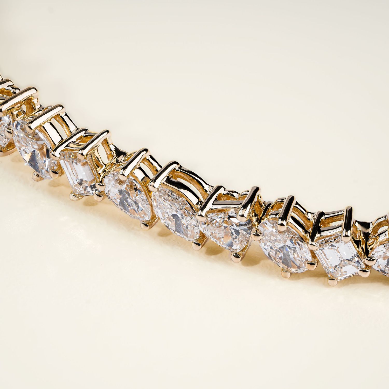 Luxurious gold bracelet featuring geometric crystal settings in zigzag pattern.