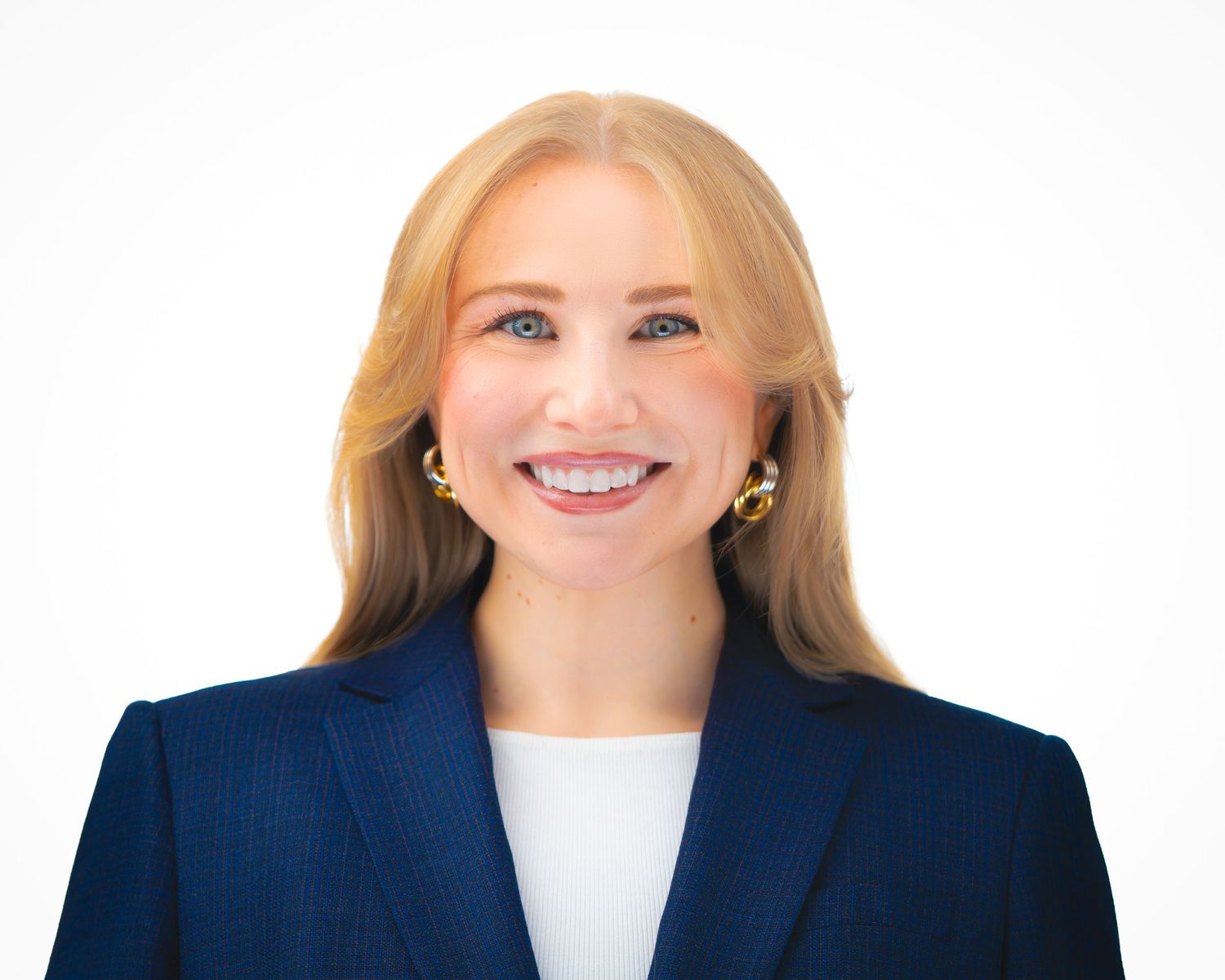 Professional headshots of a person in business attire smiling against a white background.