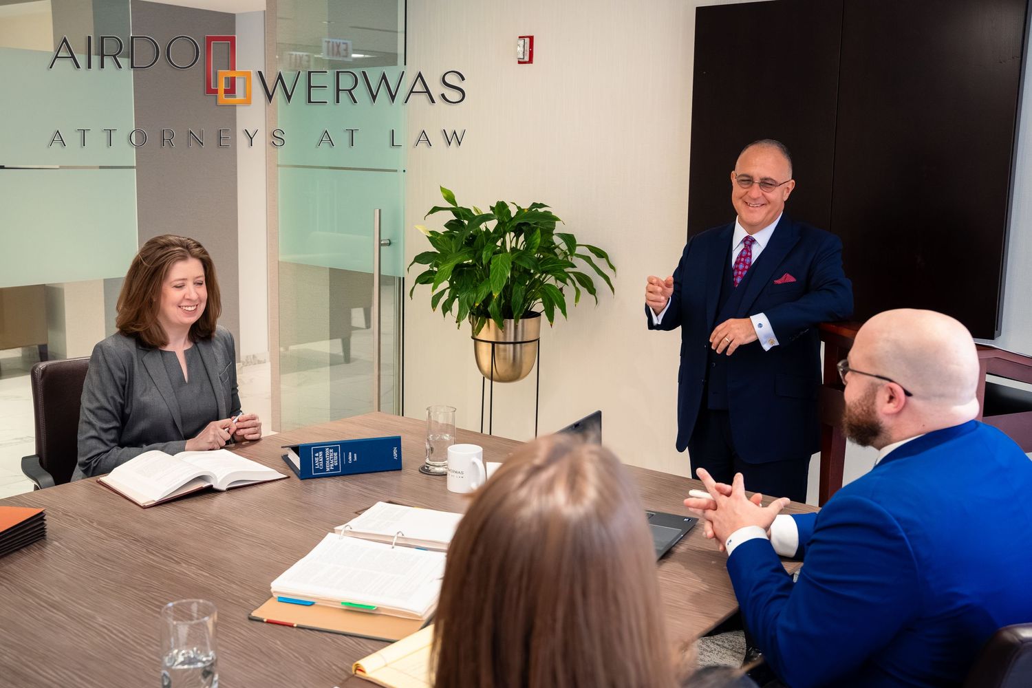 Attorneys collaborating on legal documents in modern office setting.
