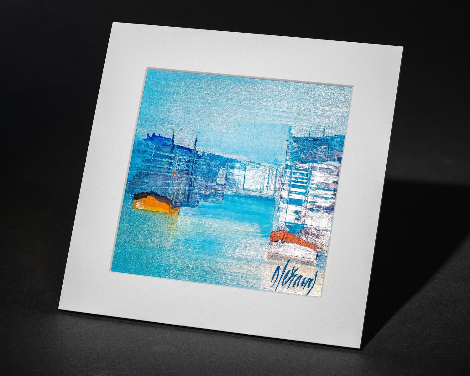 A series of minimalist art prints featuring blue and orange abstract harbor scenes displayed against a dark background.