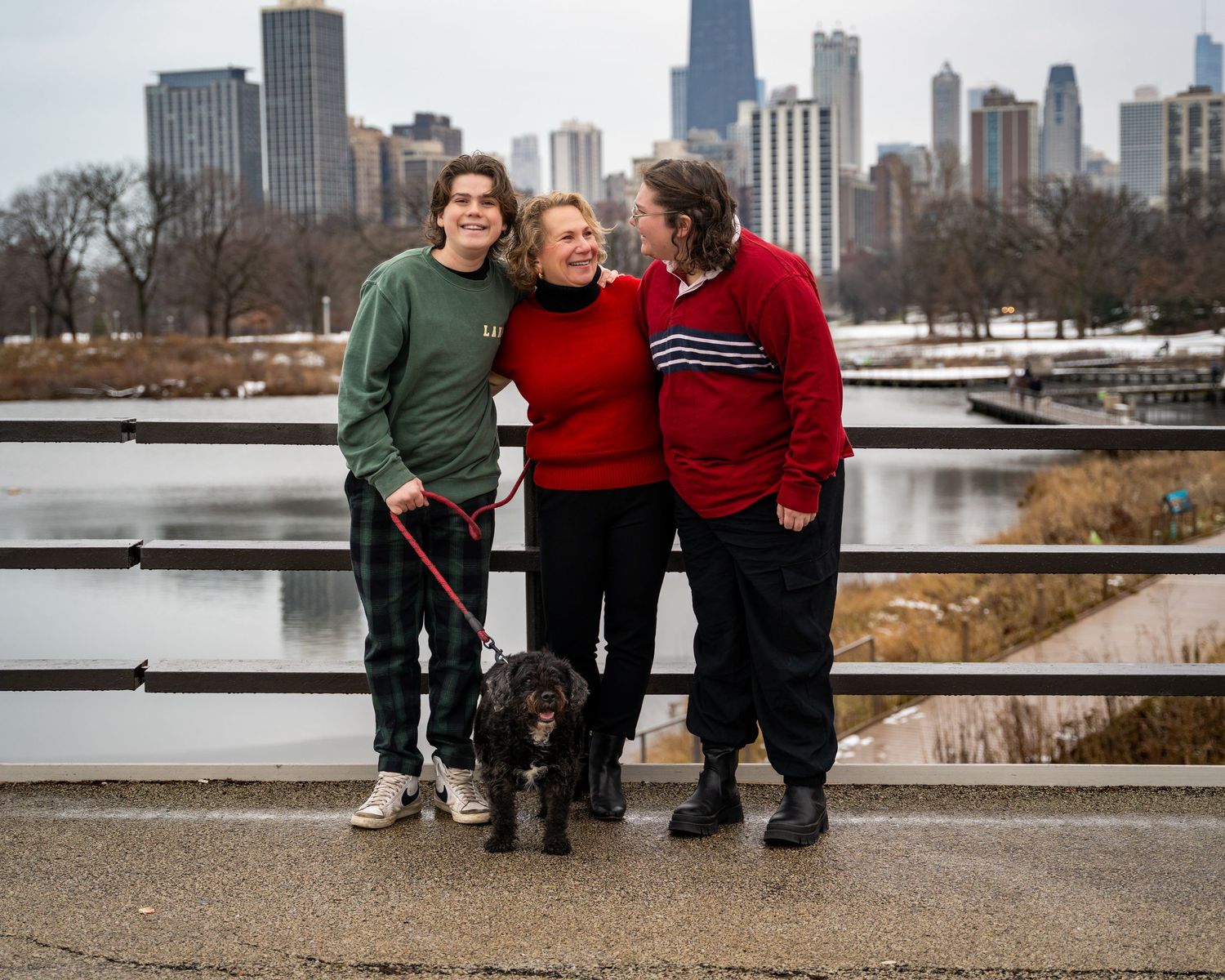 Family portrait session along Chicago's lakefront with the city skyline visible in the background.