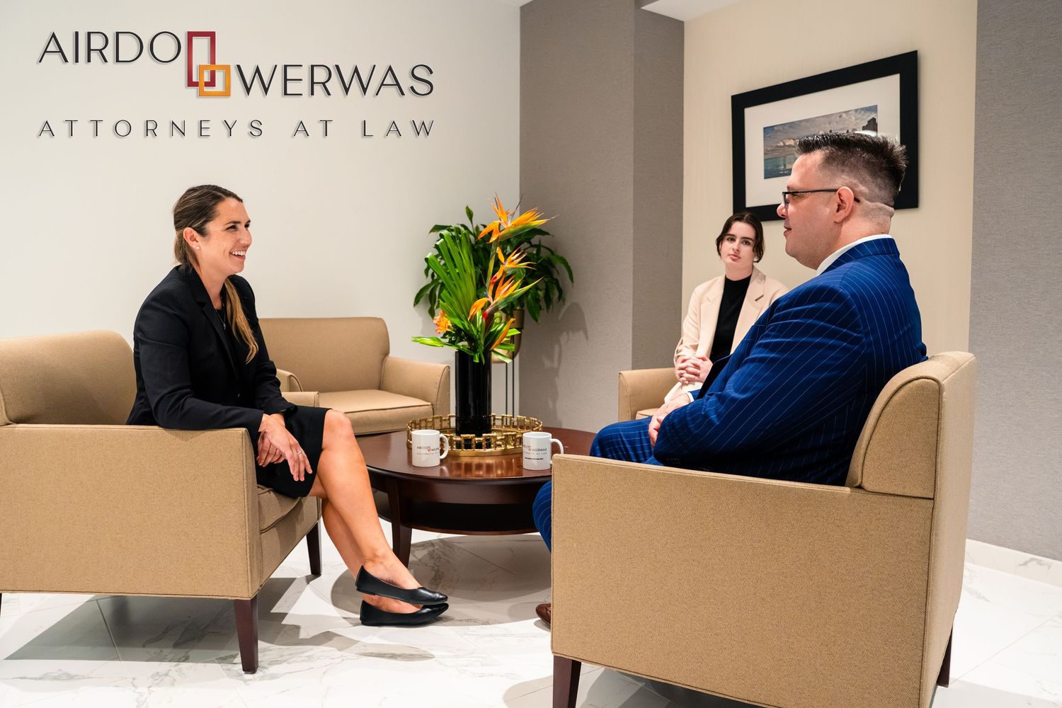 Law office conference room with attorneys reviewing documents.