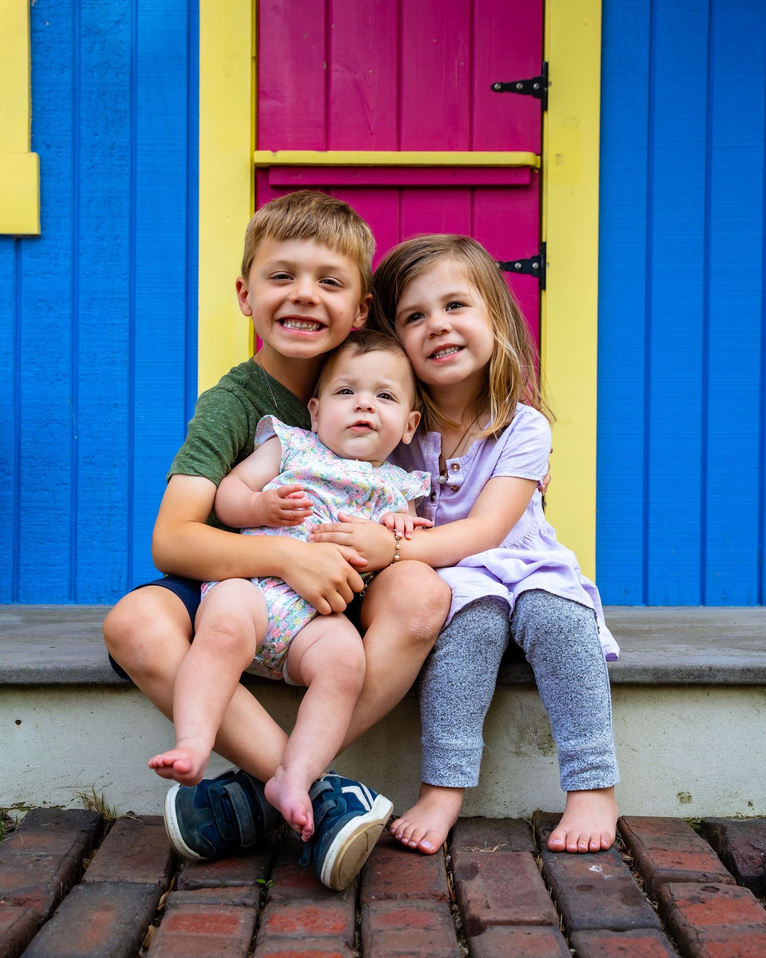 Colorful sequence of photos against bright blue and pink walls showing playful family interactions.