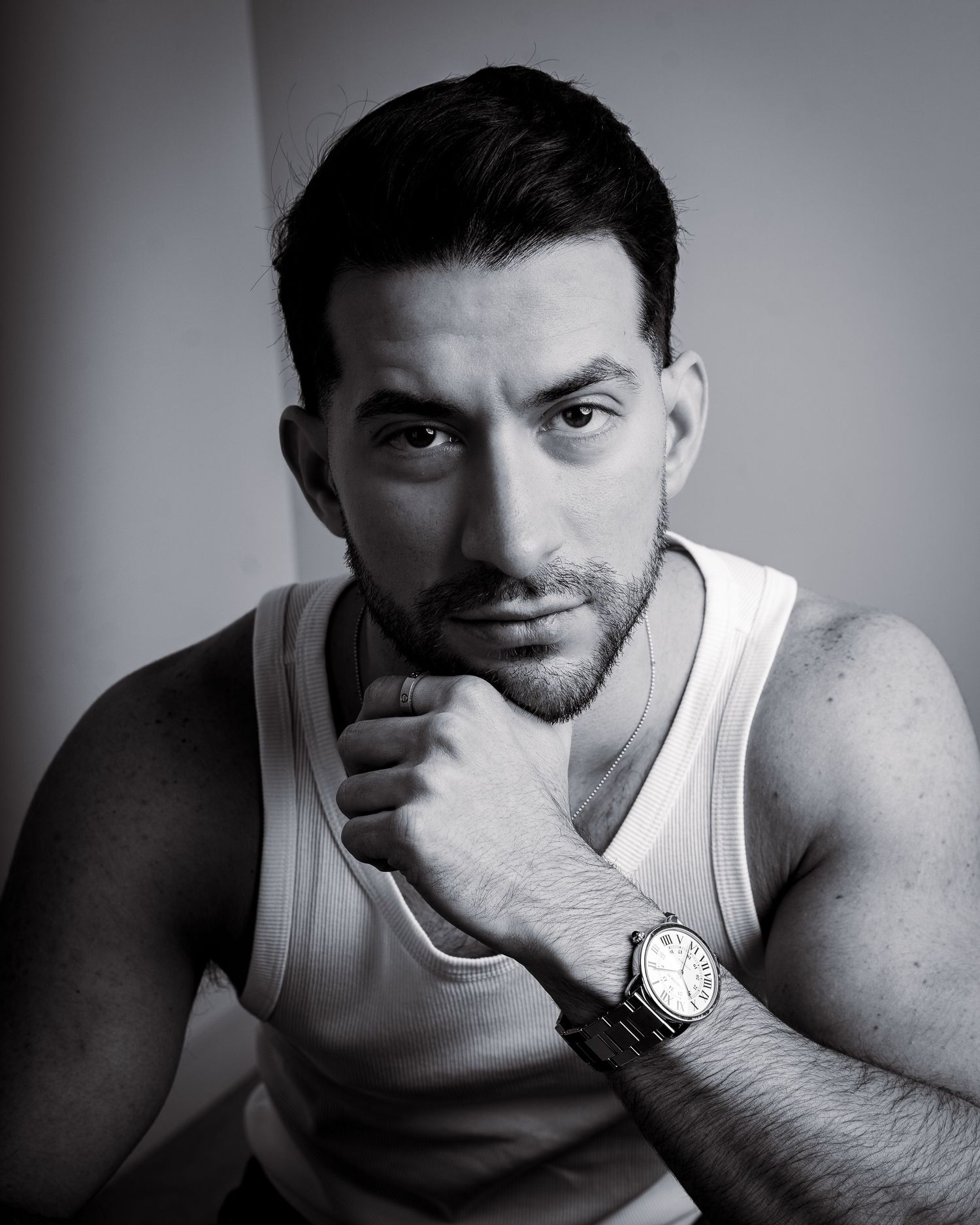 Black and white studio portraits showing casual tank top styling.
