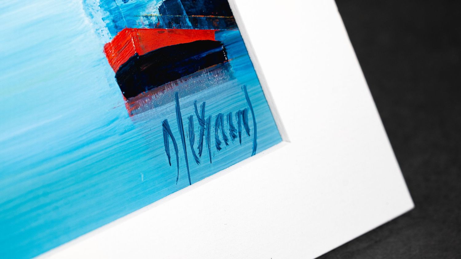 Abstract blue watercolor paint strokes on white paper creating a gradient effect.