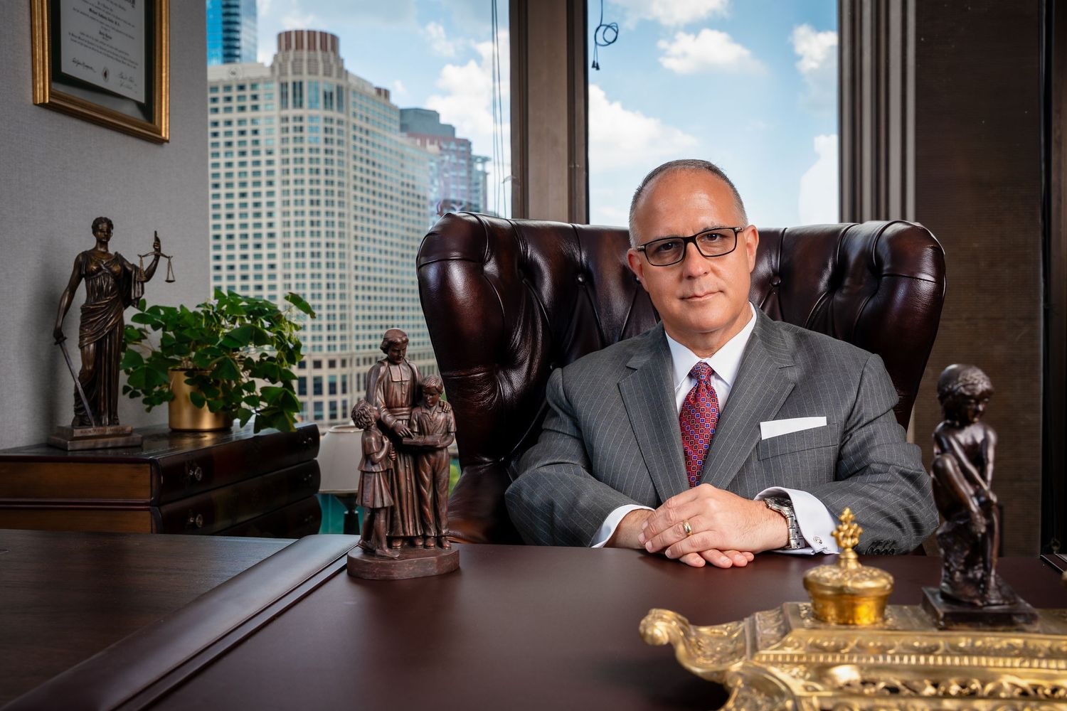 Professional law office conference room with city views and modern decor.