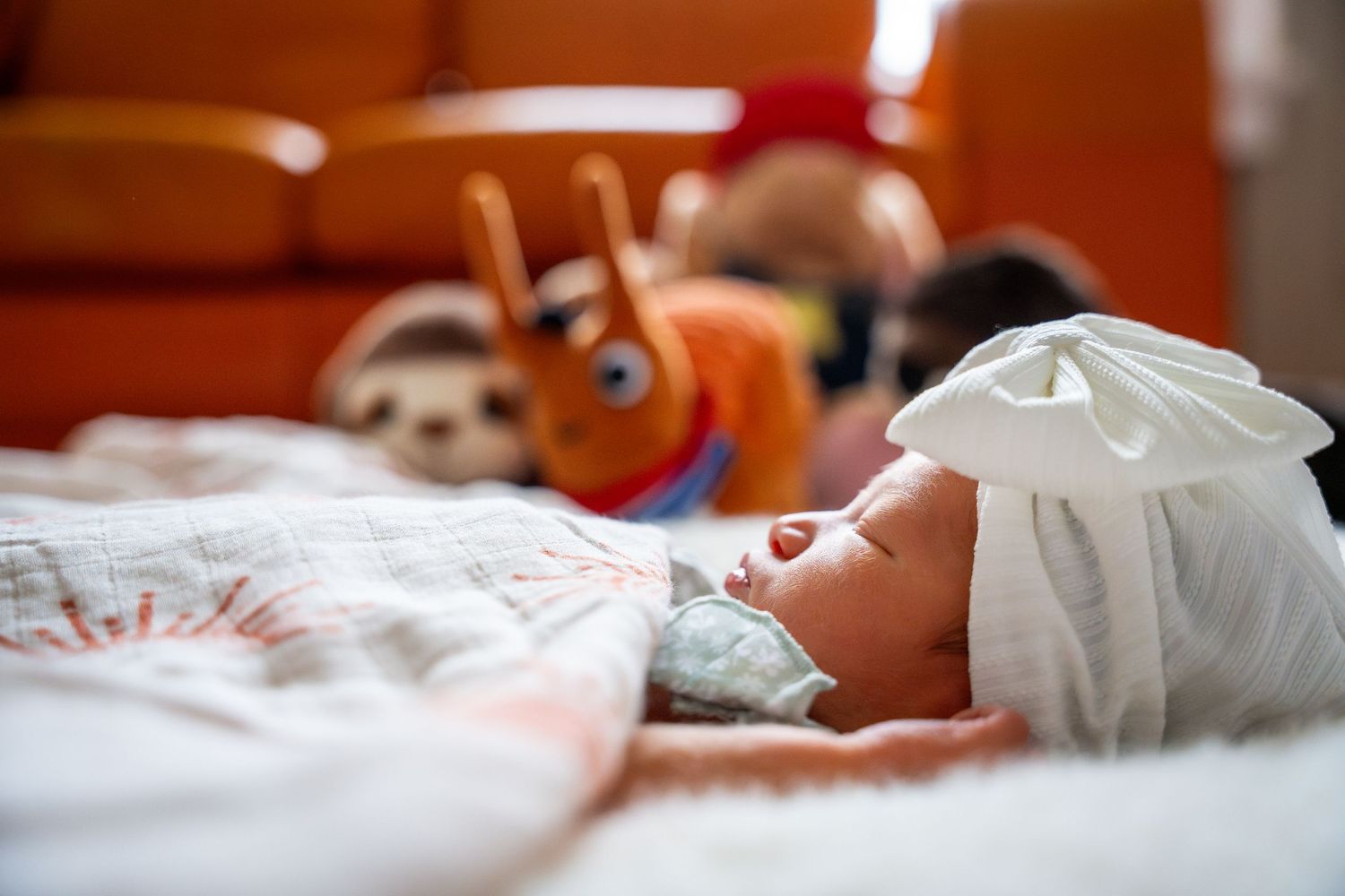 A series of photos showing a sleeping baby arranged in a horizontal collage.