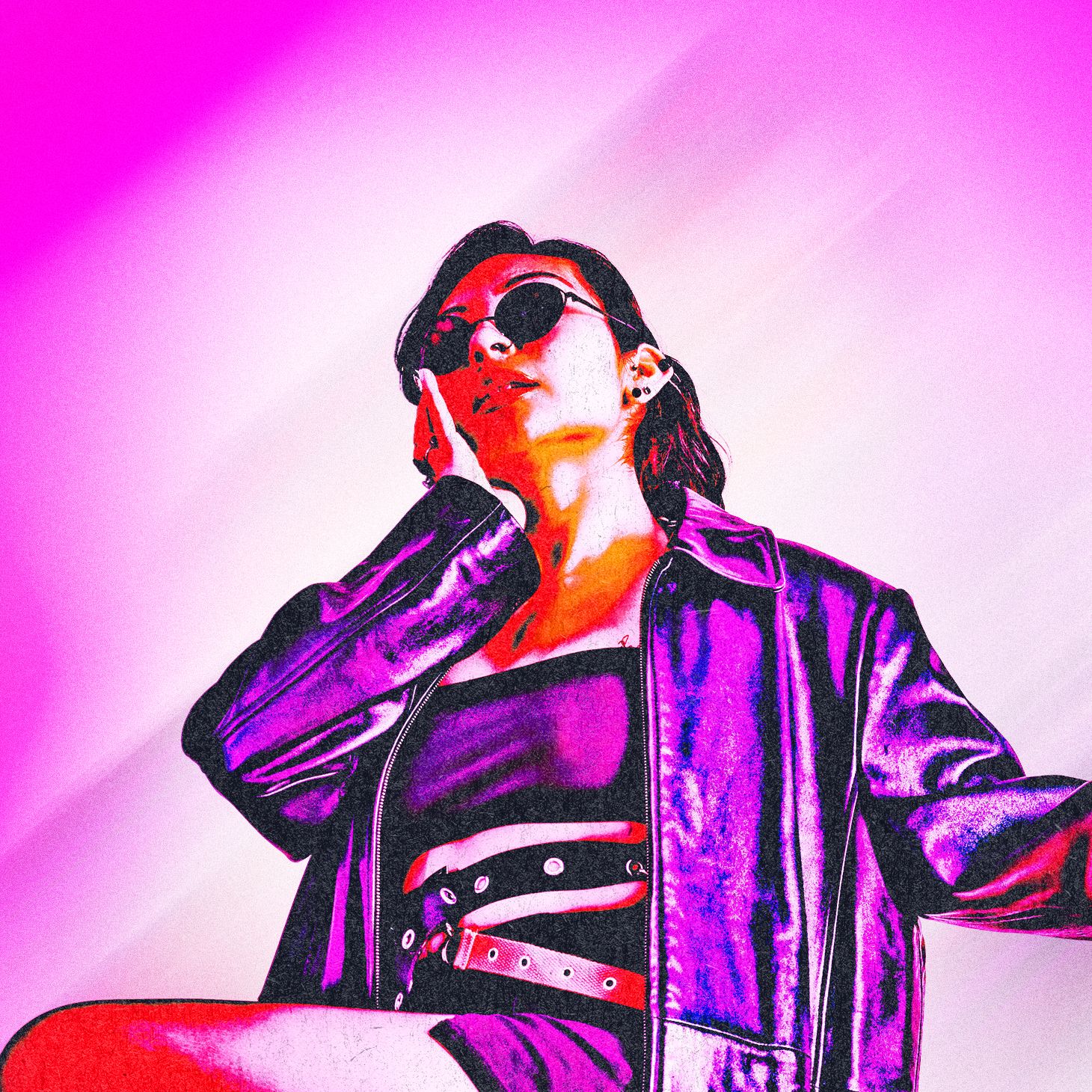 A person in a purple metallic jacket poses against a bright pink background creating a vibrant fashion aesthetic.