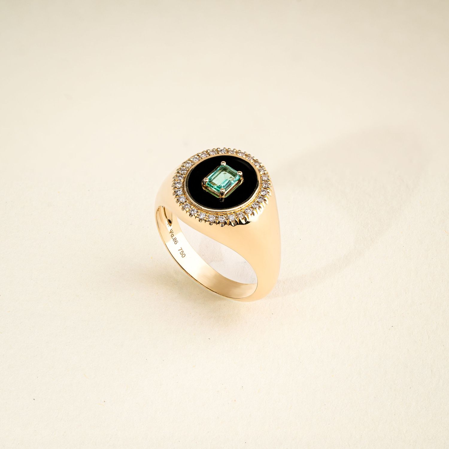 Rose gold ring with turquoise stone and crystal accents photographed on white background.