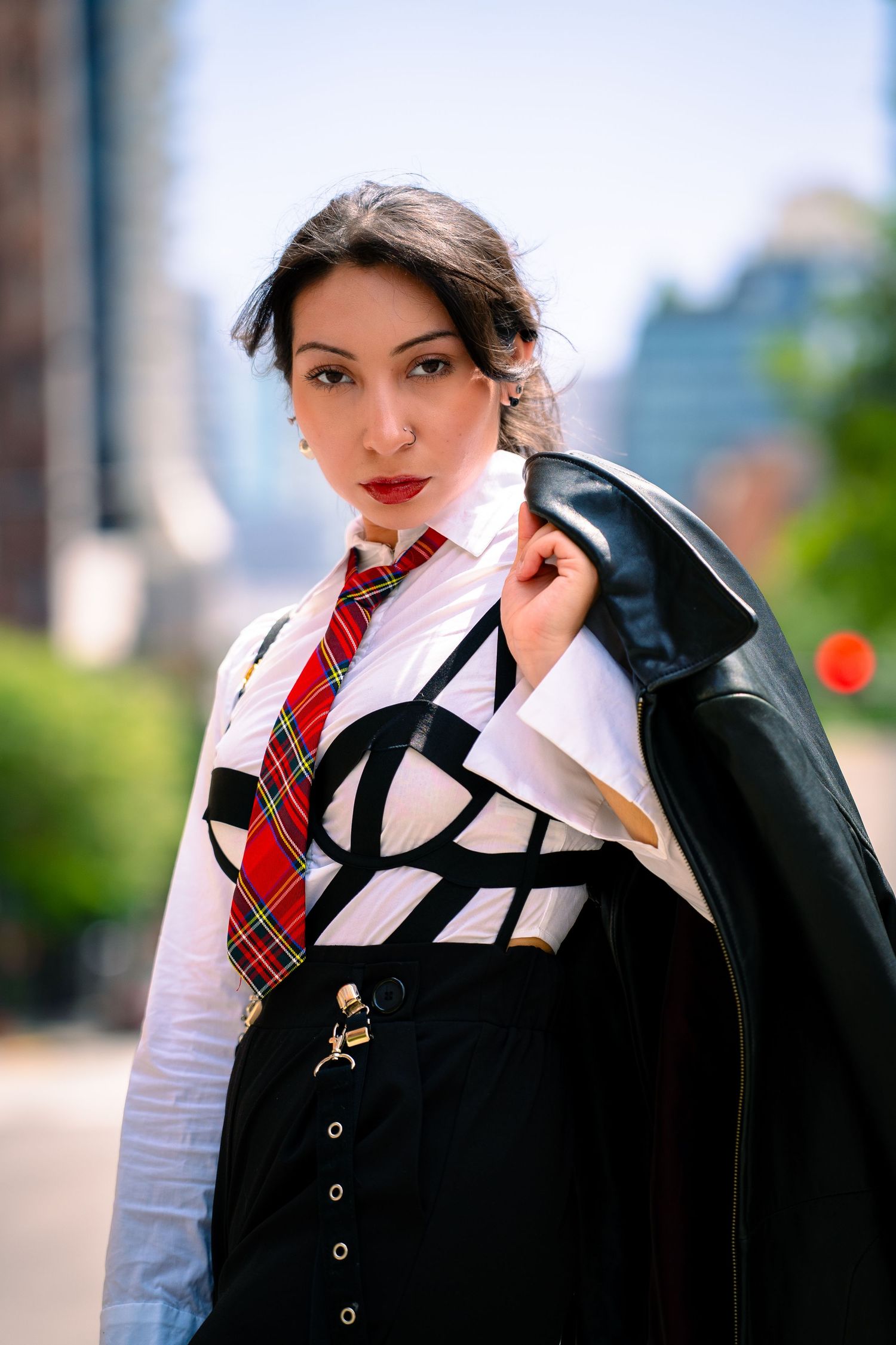 Fashion portrait series showing vintage-inspired outfit with red tie and leather jacket.