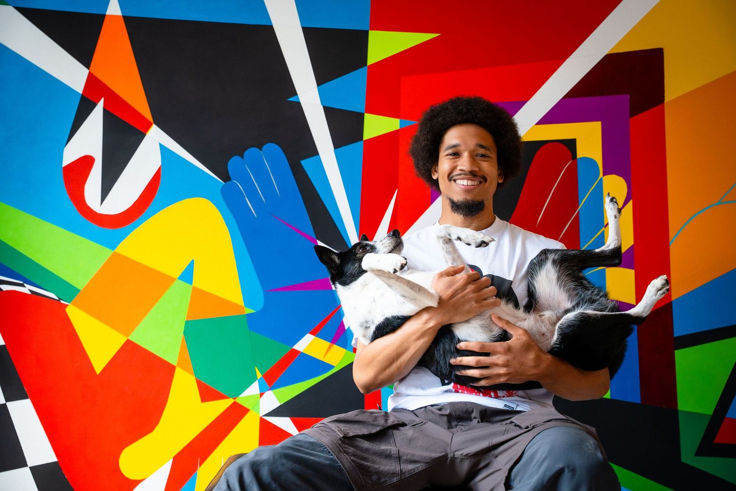 Colorful geometric wall art installation with bold angular shapes and contrasting patterns.