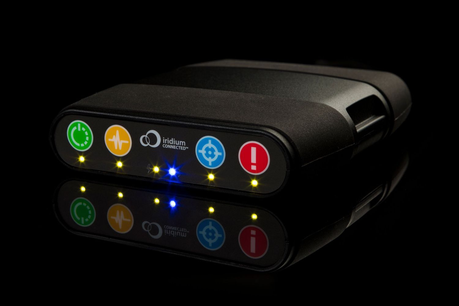 Black electronic device with illuminated colored buttons and indicators against dark background.