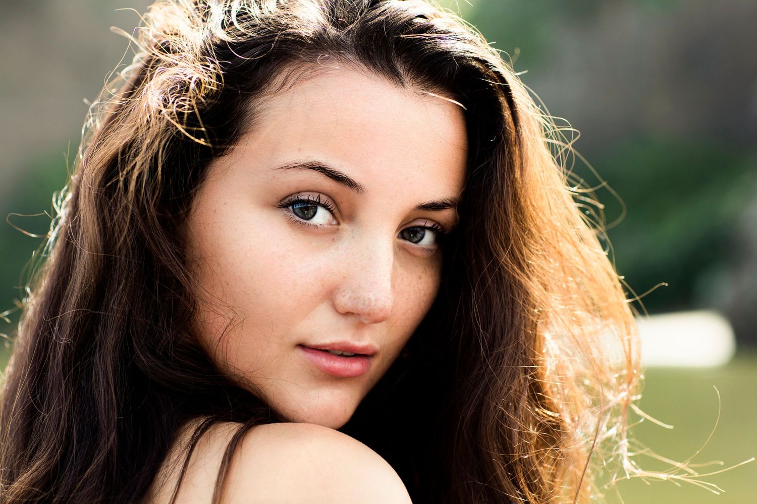 Portrait series featuring natural lighting and soft outdoor bokeh effects.