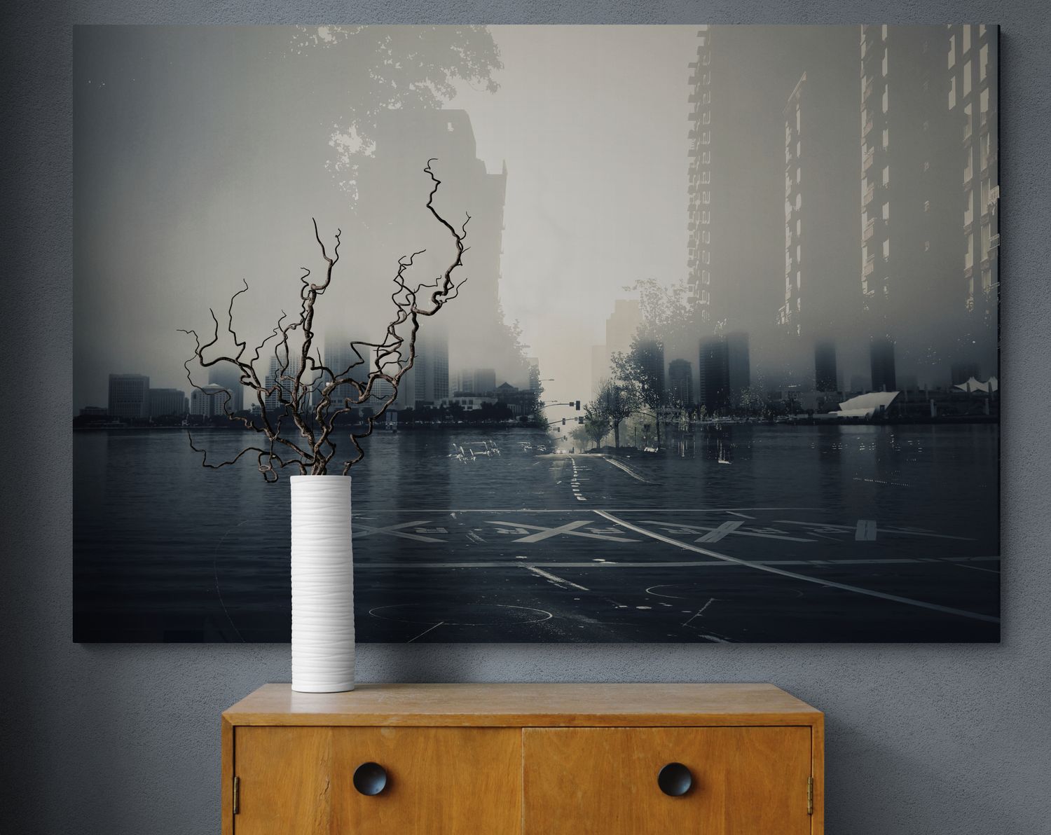 Dark atmospheric cityscape photographs mounted above wooden furniture in modern interior.