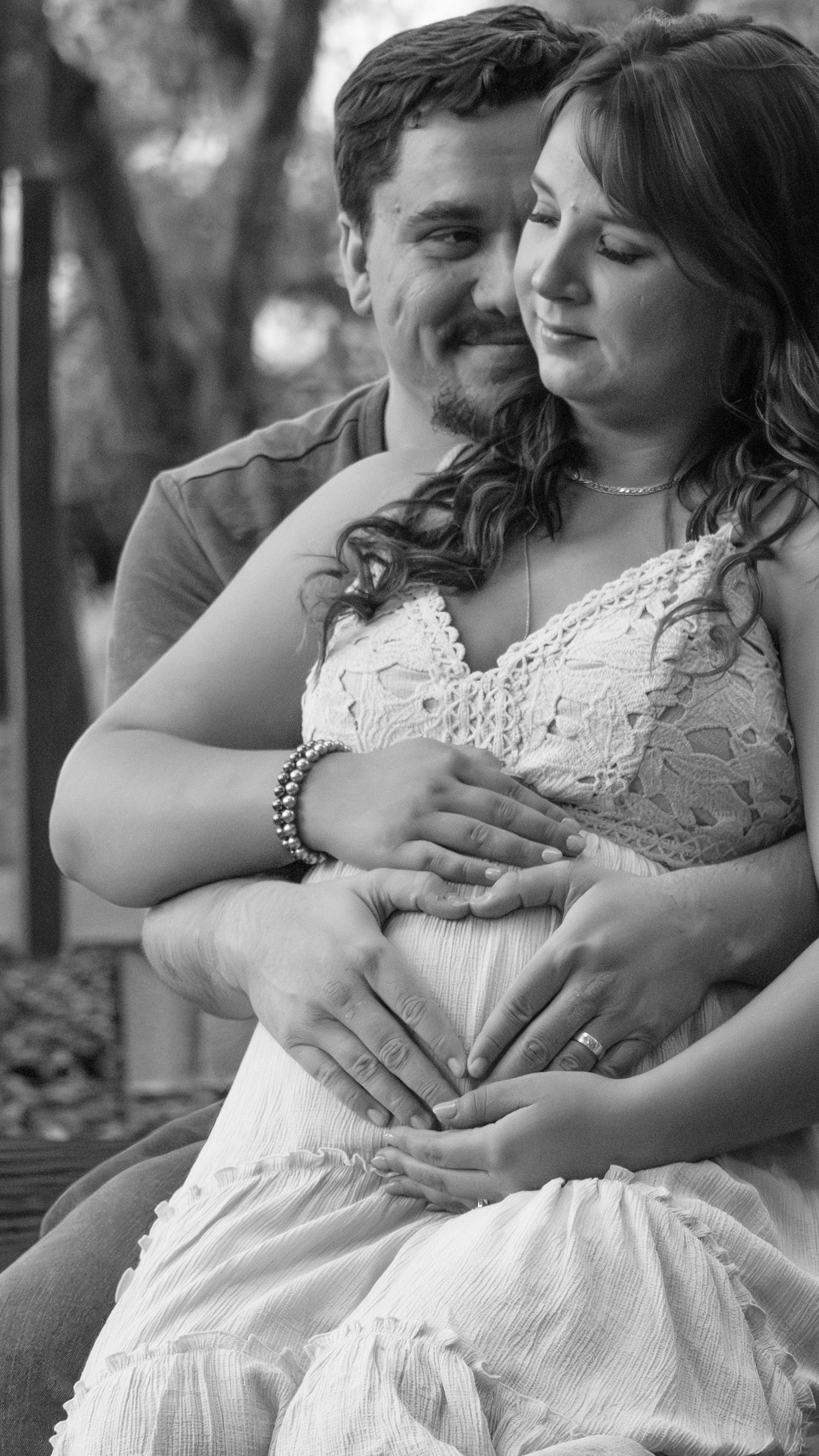 Expecting couple embracing outdoors, maternity portrait in natural light, black and white, romantic, Jolie & Rae Photography Lodi Lake, CA
