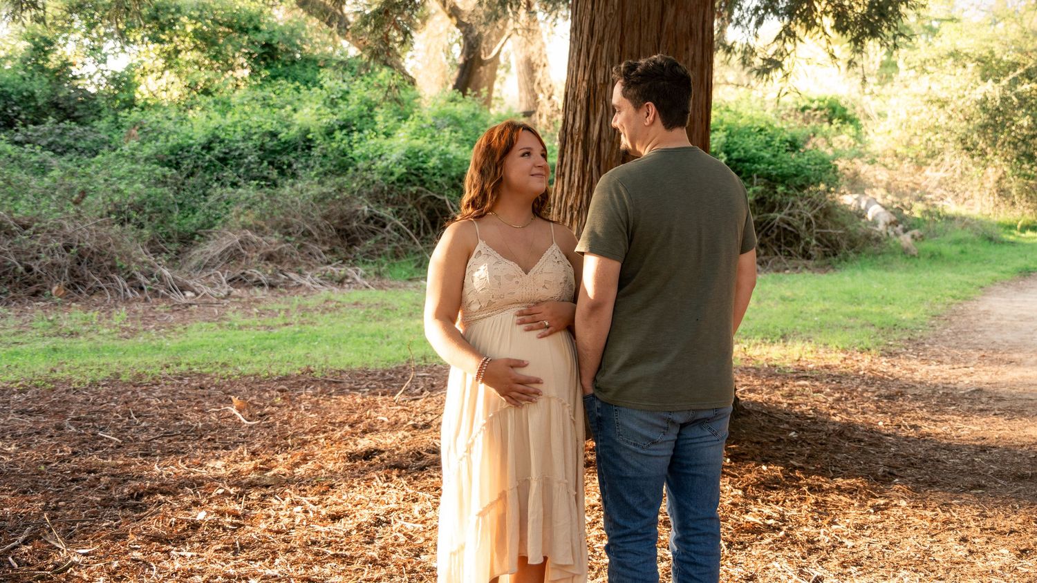 Expecting father kissing pregnant belly, maternity portrait golden hour near Folsom California Jolie & Rae Photography