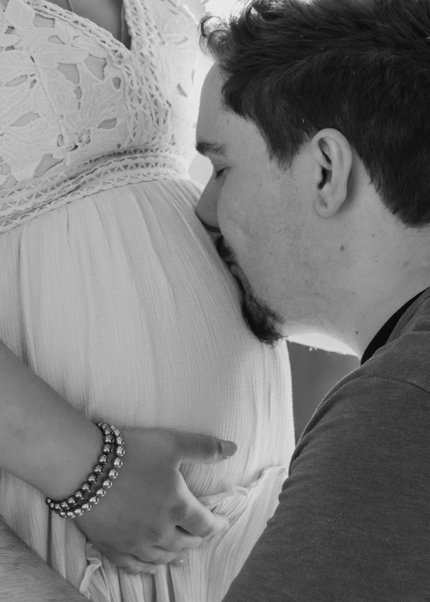 A romantic black and white photo series showing tender moments between a couple in wedding attire near Reno CA