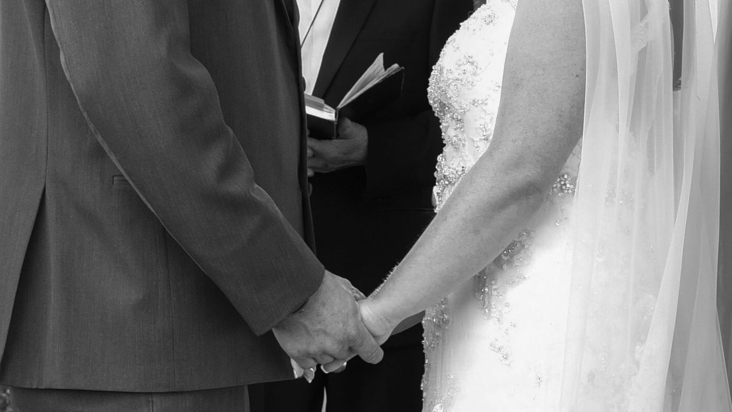 Wedding ceremony moments captured in a series of black and white photographs.