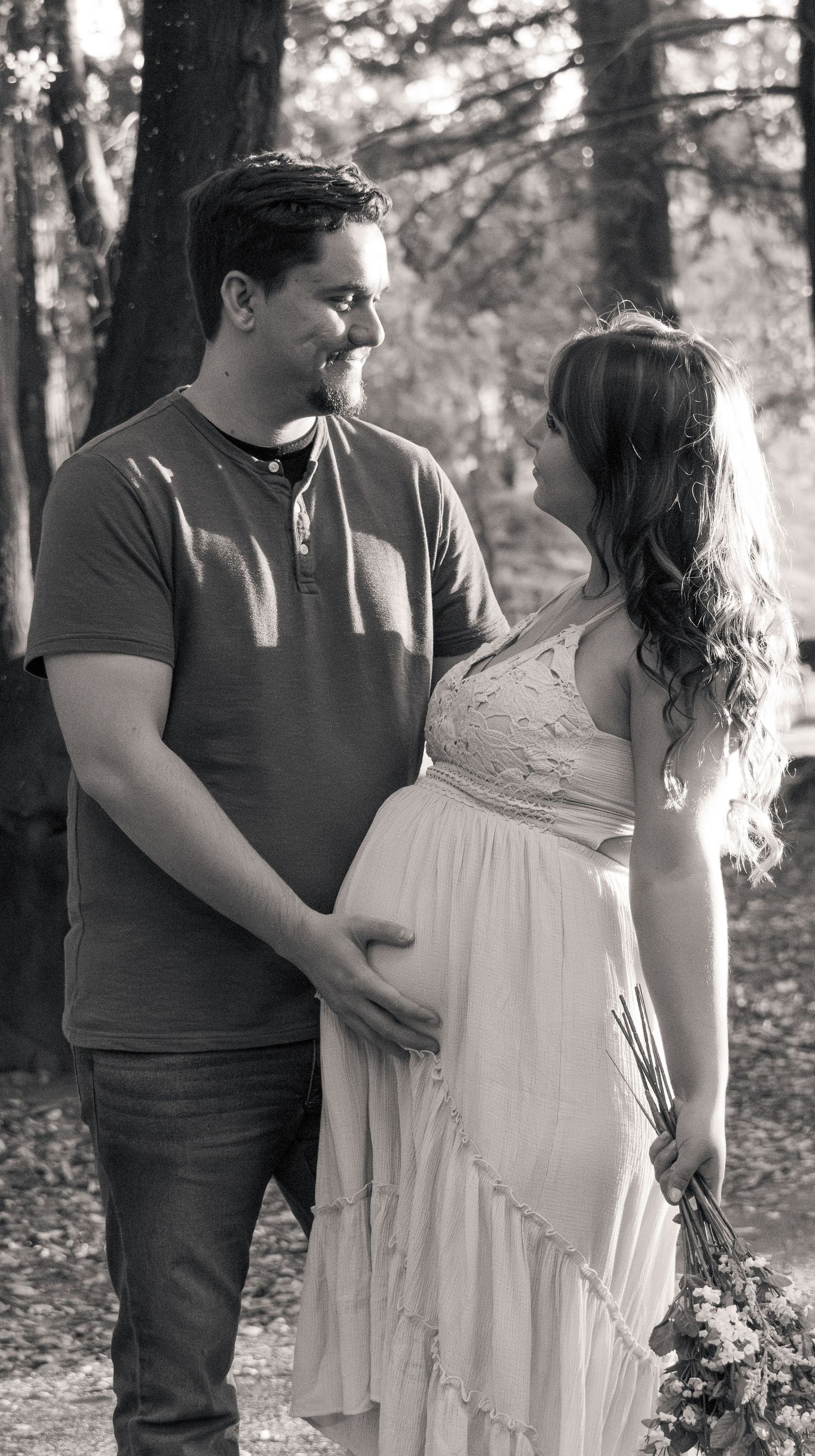 Expecting couple holding hands in beautiful black and white, maternity portrait near Rocklin California Jolie & Rae Photography