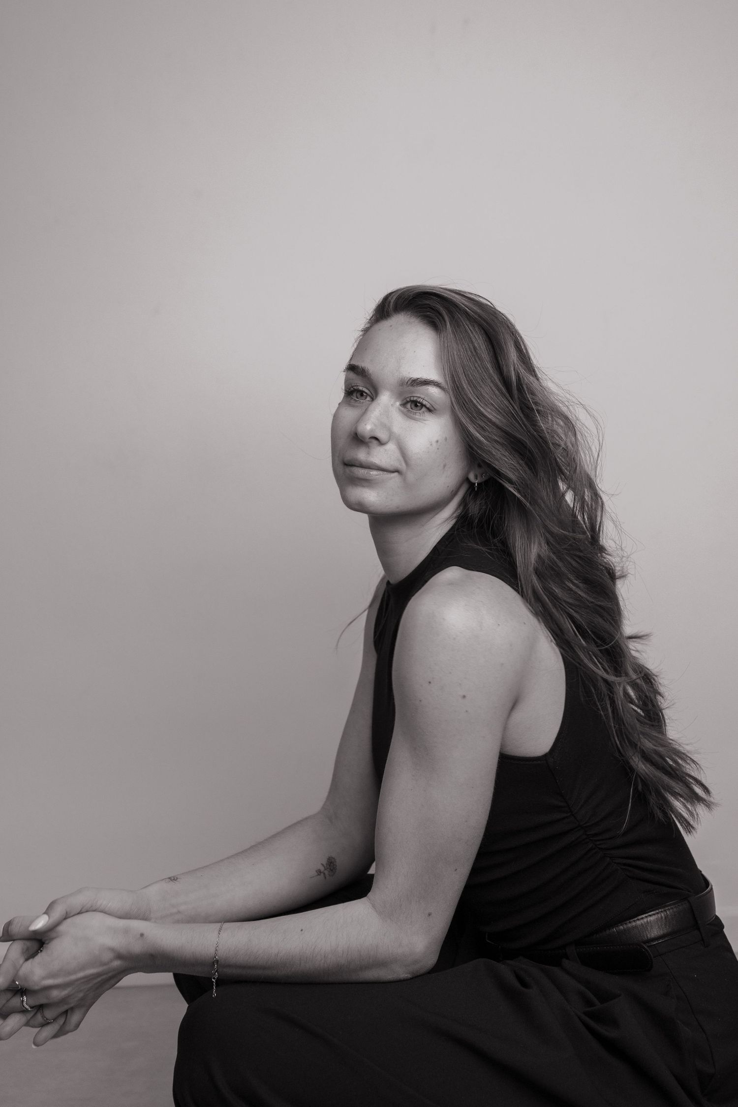 Artistic black and white portrait series showing graceful movement and expression.