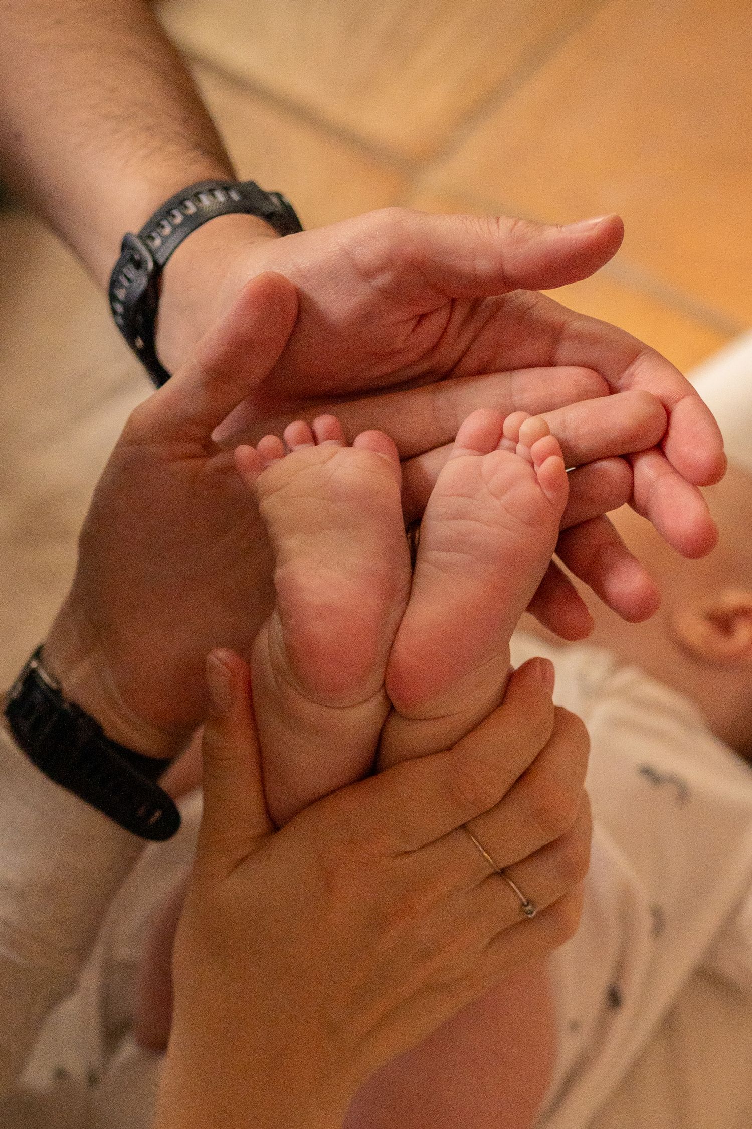 Close-up sequence of hands giving a gentle foot massage.