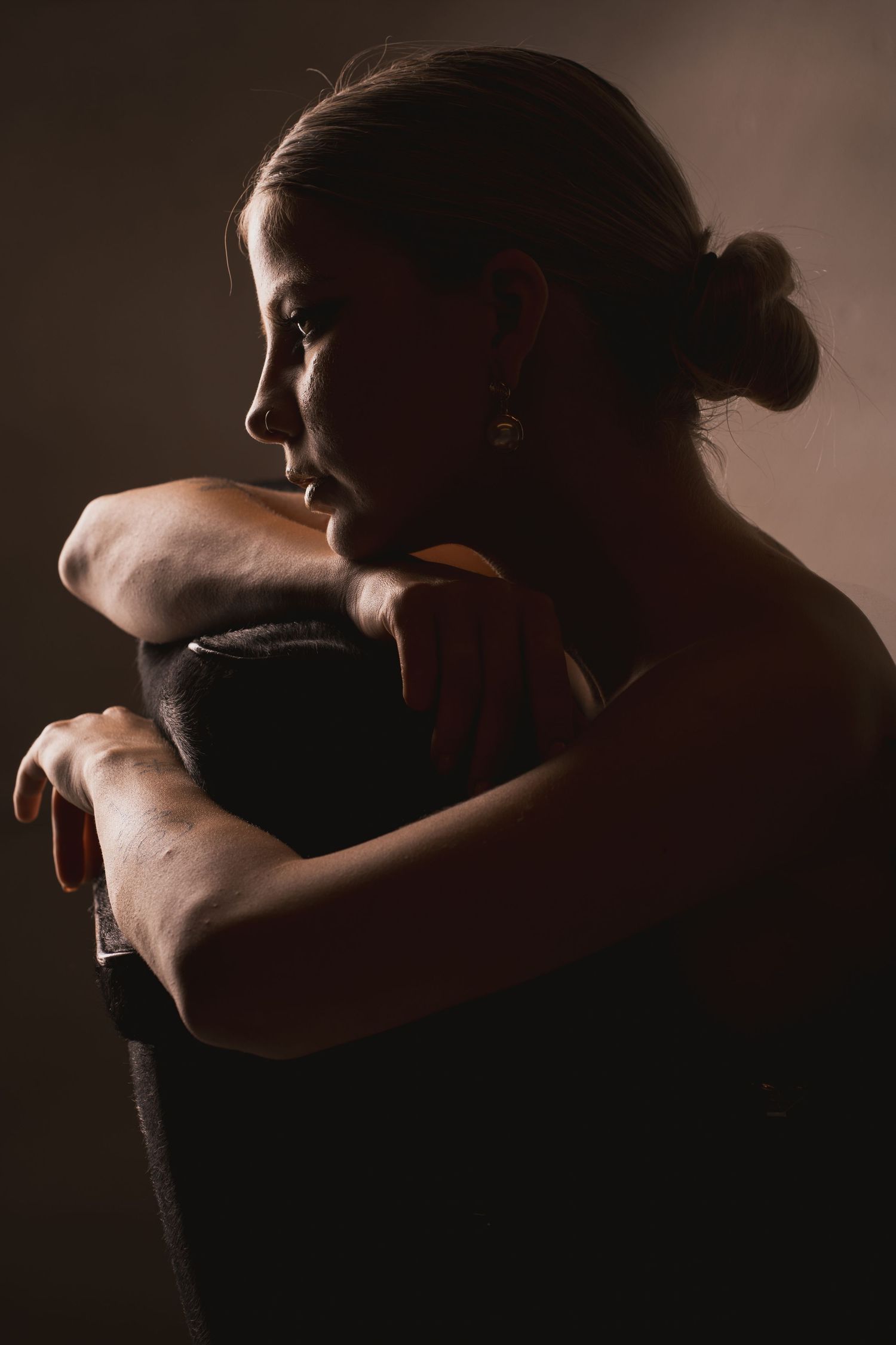Intimate black and white portraits showing emotional embraces in moody lighting.