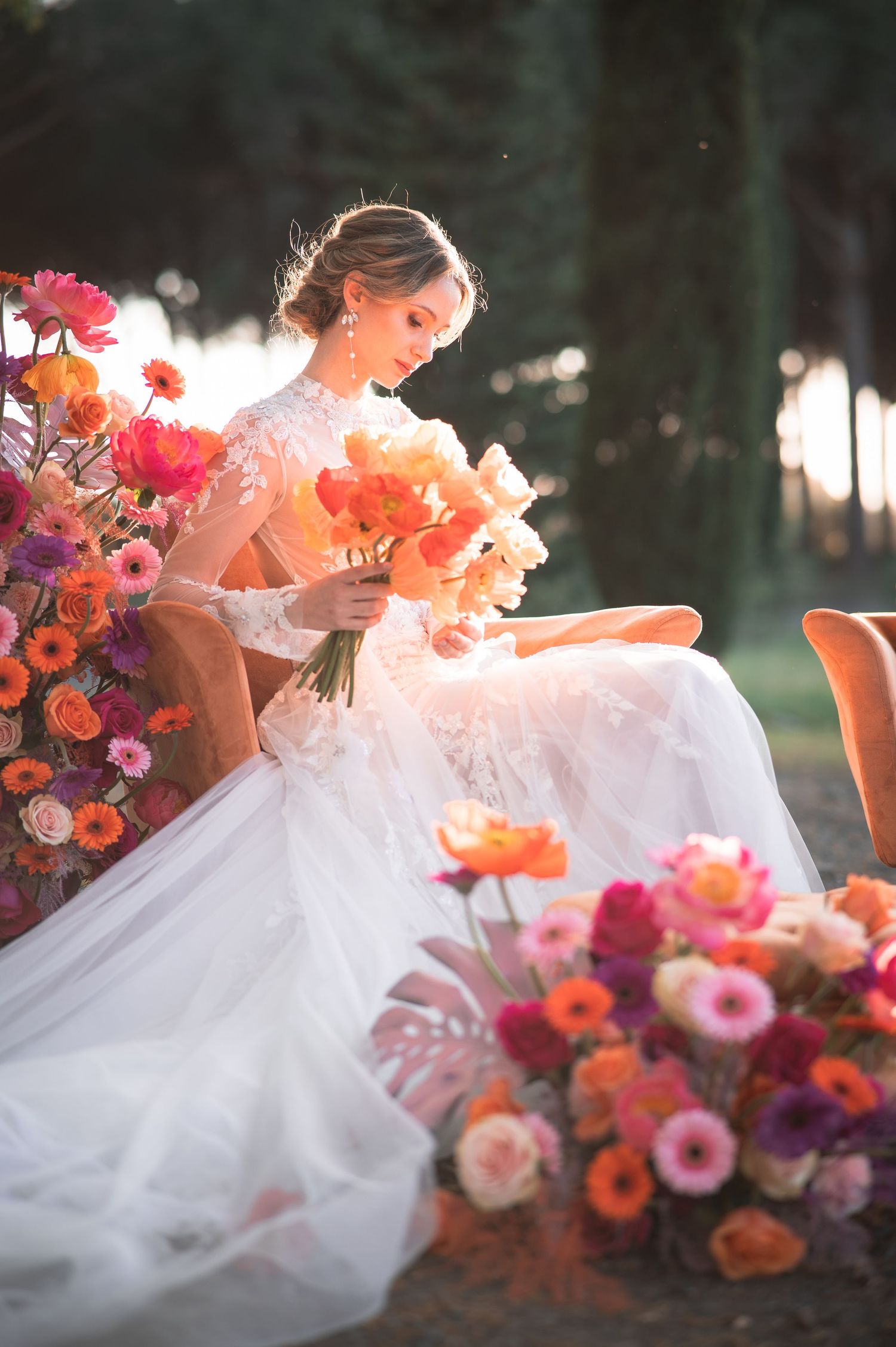 Elegant bridal portrait in an outdoor garden, with floral surroundings and soft tones. Natural, emotional wedding photography in Tuscany